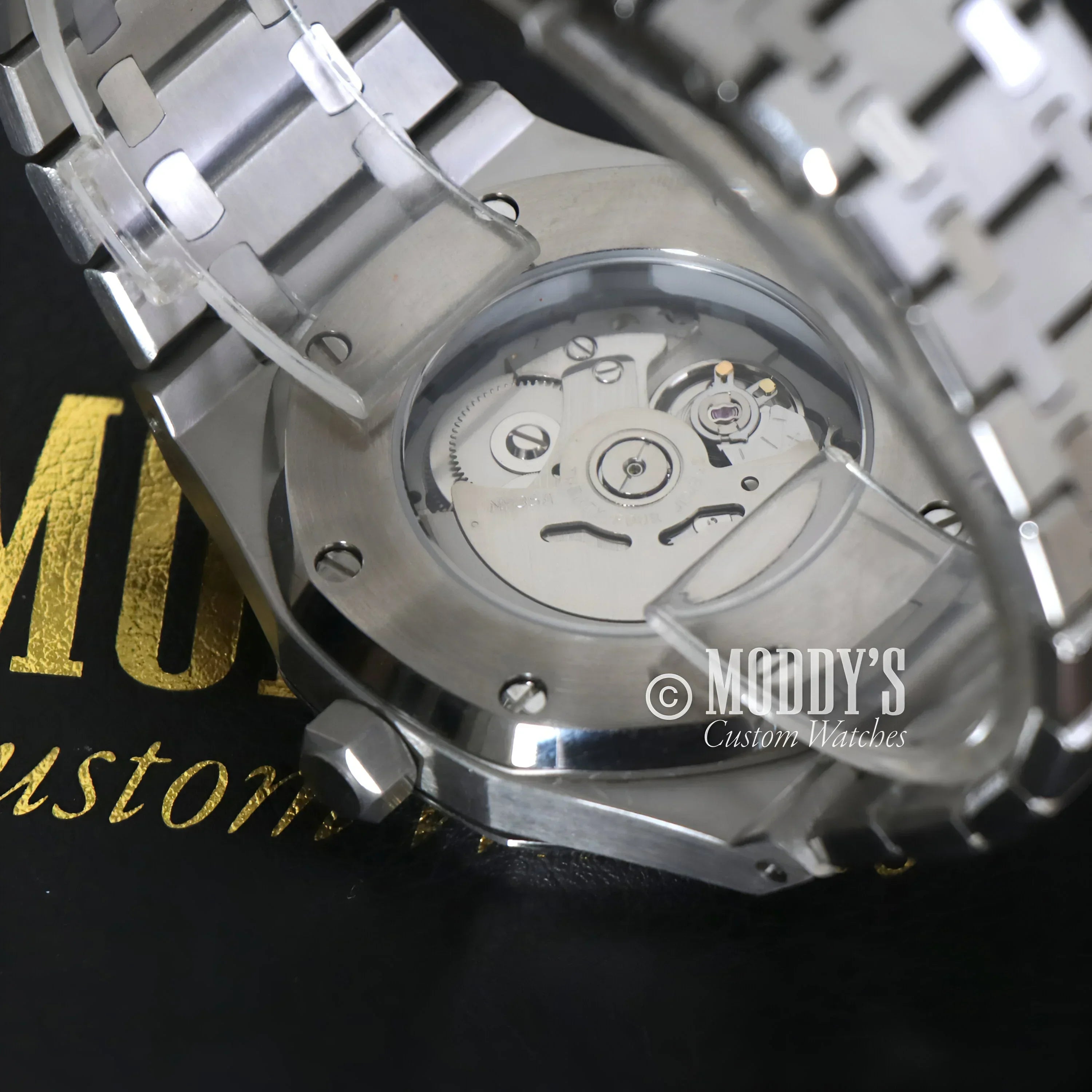 Silver Royal Seikoak wristwatch with visible movement and Seiko NH35 automatic features