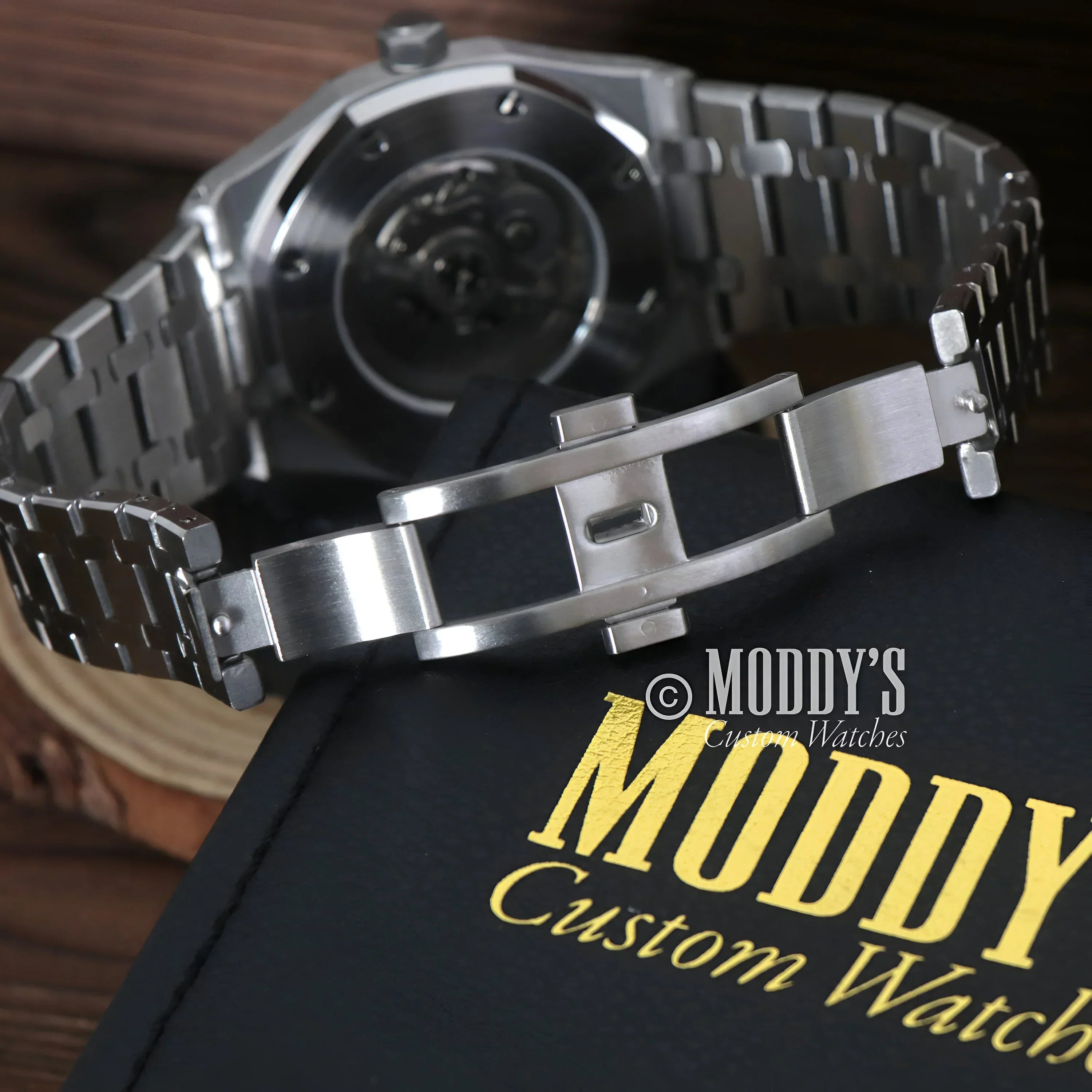 Silver wristwatch with metal band from Royal Seikoak featuring NH35 automatic movement