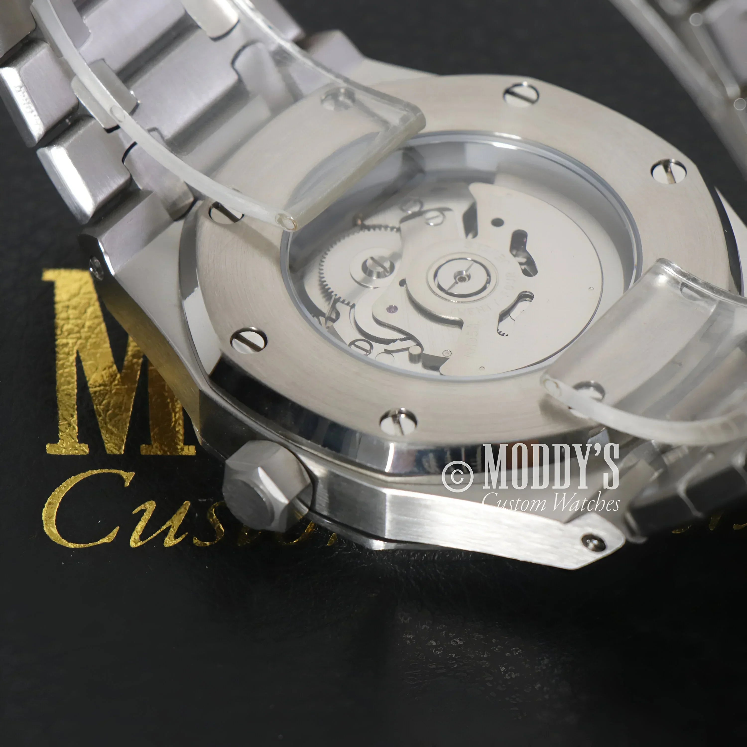 Silver wristwatch with exposed movement, Seiko Mod Royal, featuring Seiko NH35 automatic