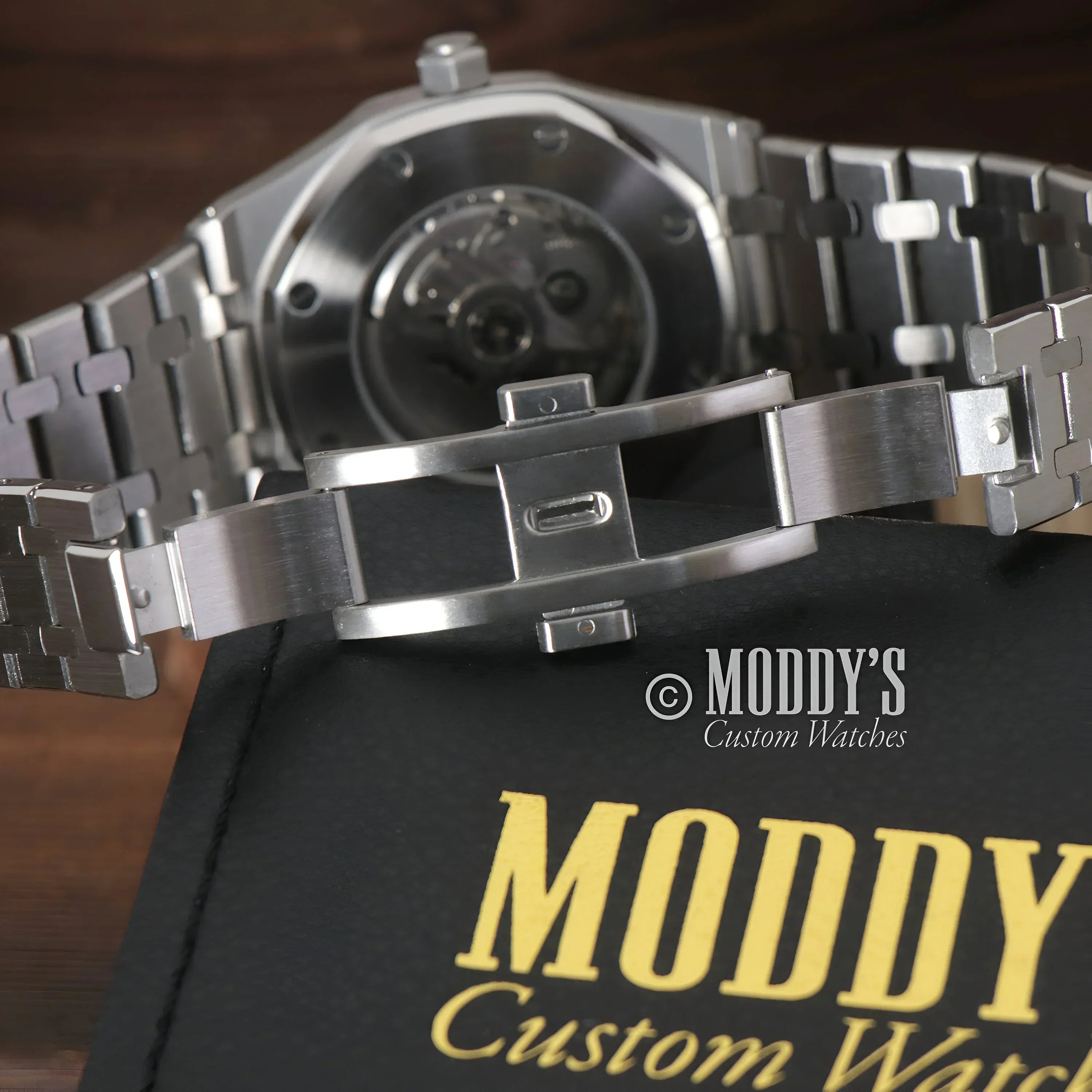 Silver wristwatch with exposed movement, featuring Seiko NH35 automatic in Mod Royal Oak design