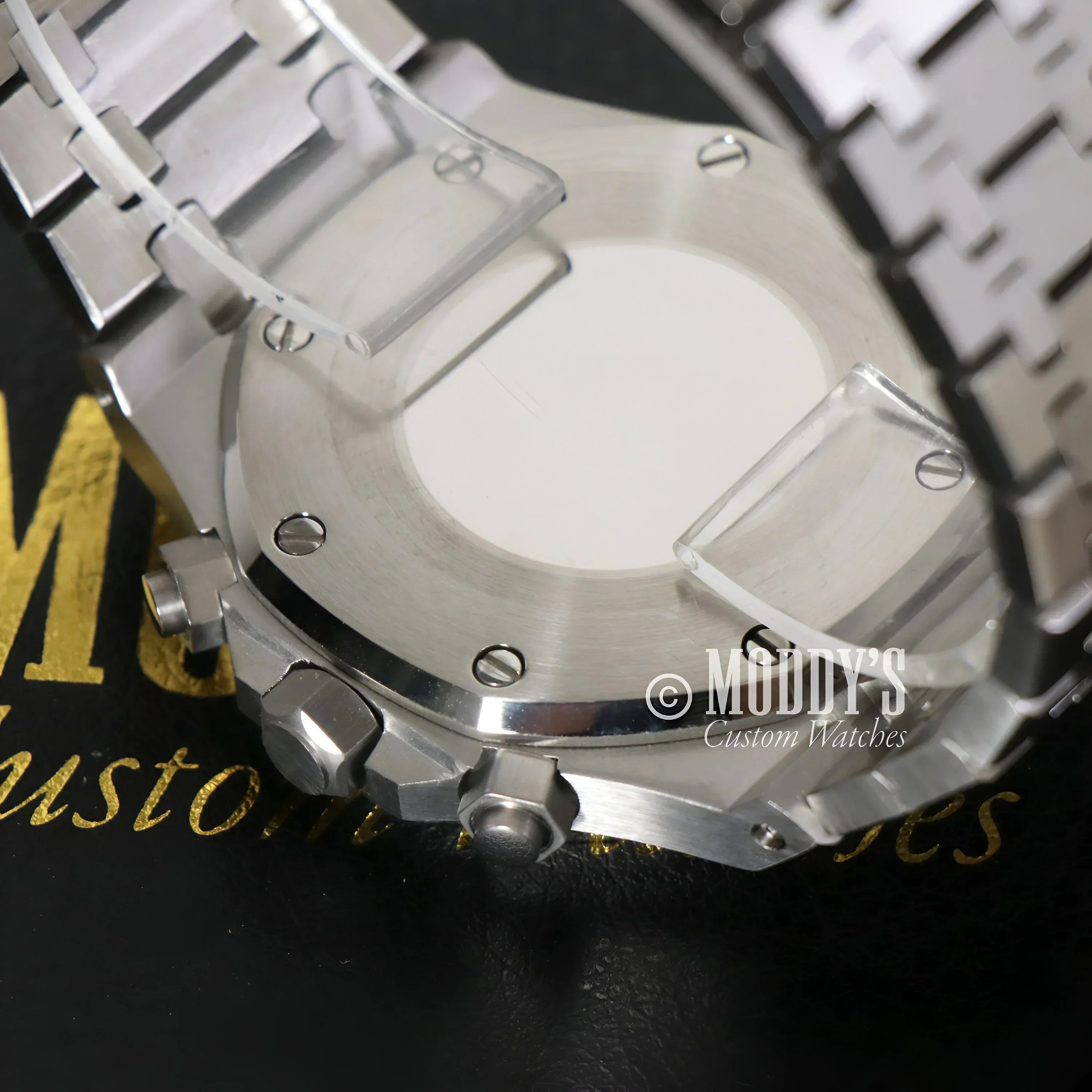 Silver wristwatch with metal band featuring VK63 hybrid movement, Royal Seikoak design
