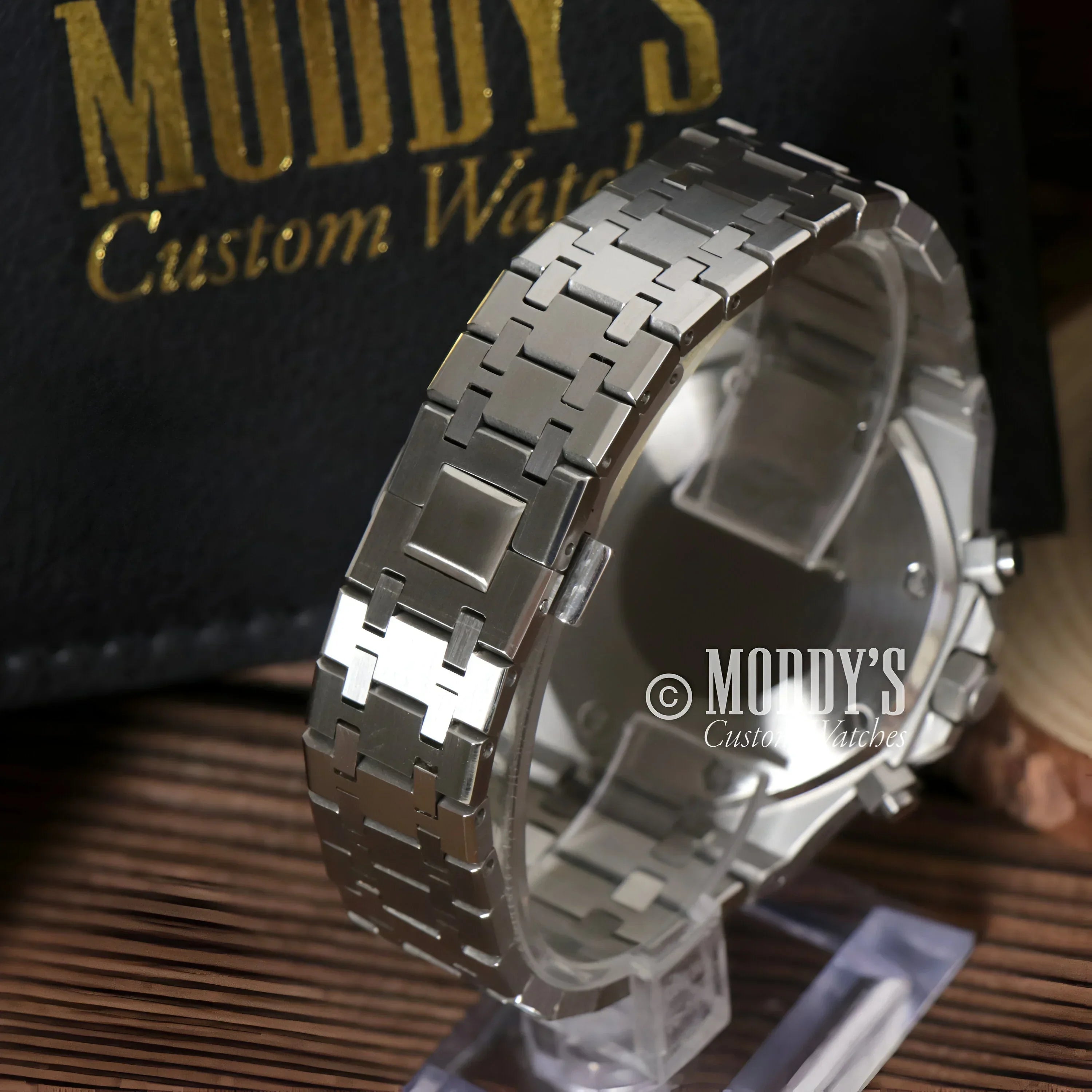 Silver metal watch with linked band from Royal Seikoak featuring VK63 hybrid movement