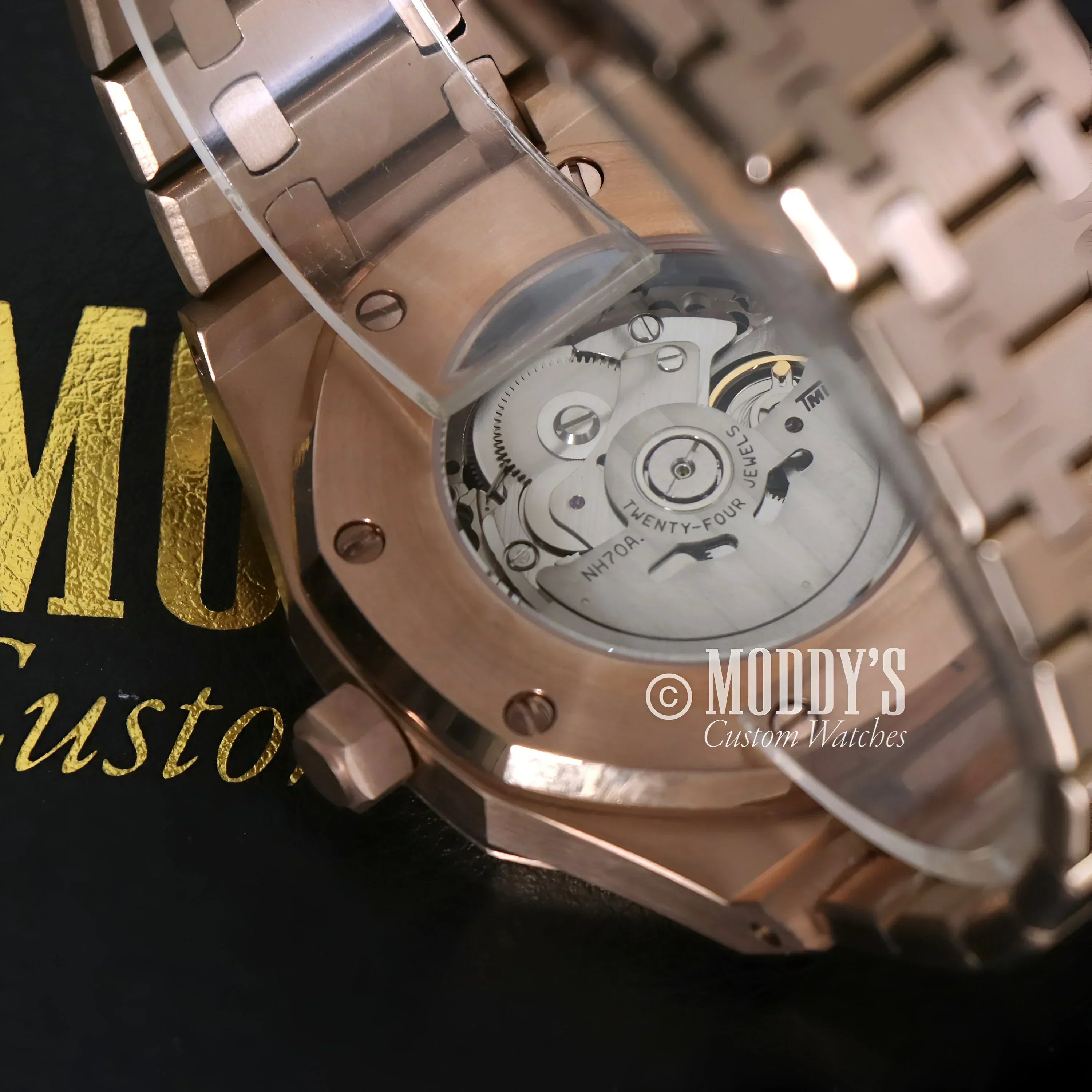 Rose Gold Skeleton Royal Seikoak wristwatch showcasing visible movement design