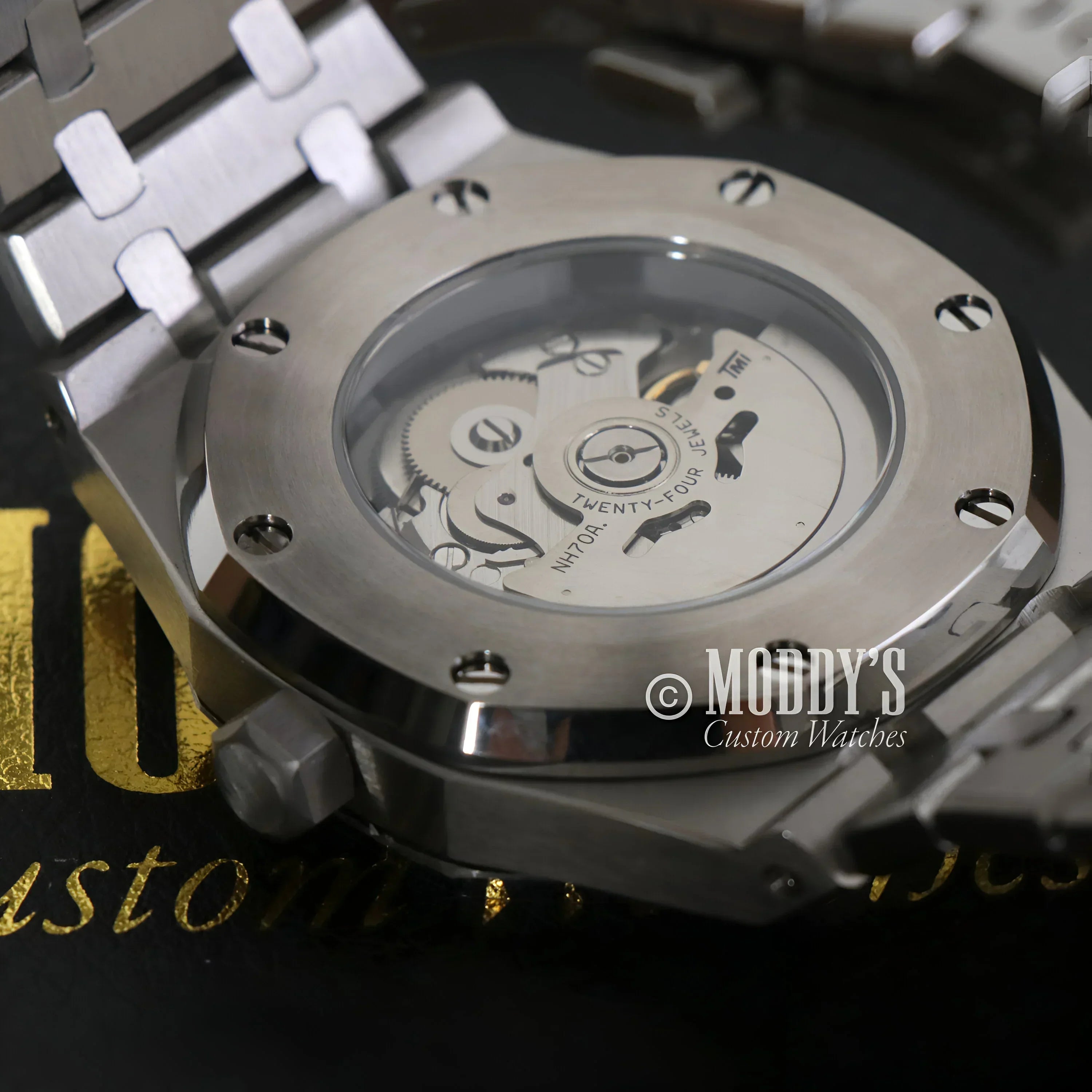 Silver Seiko mod Royal Skeleton wristwatch showcasing intricate NH70 automatic movement