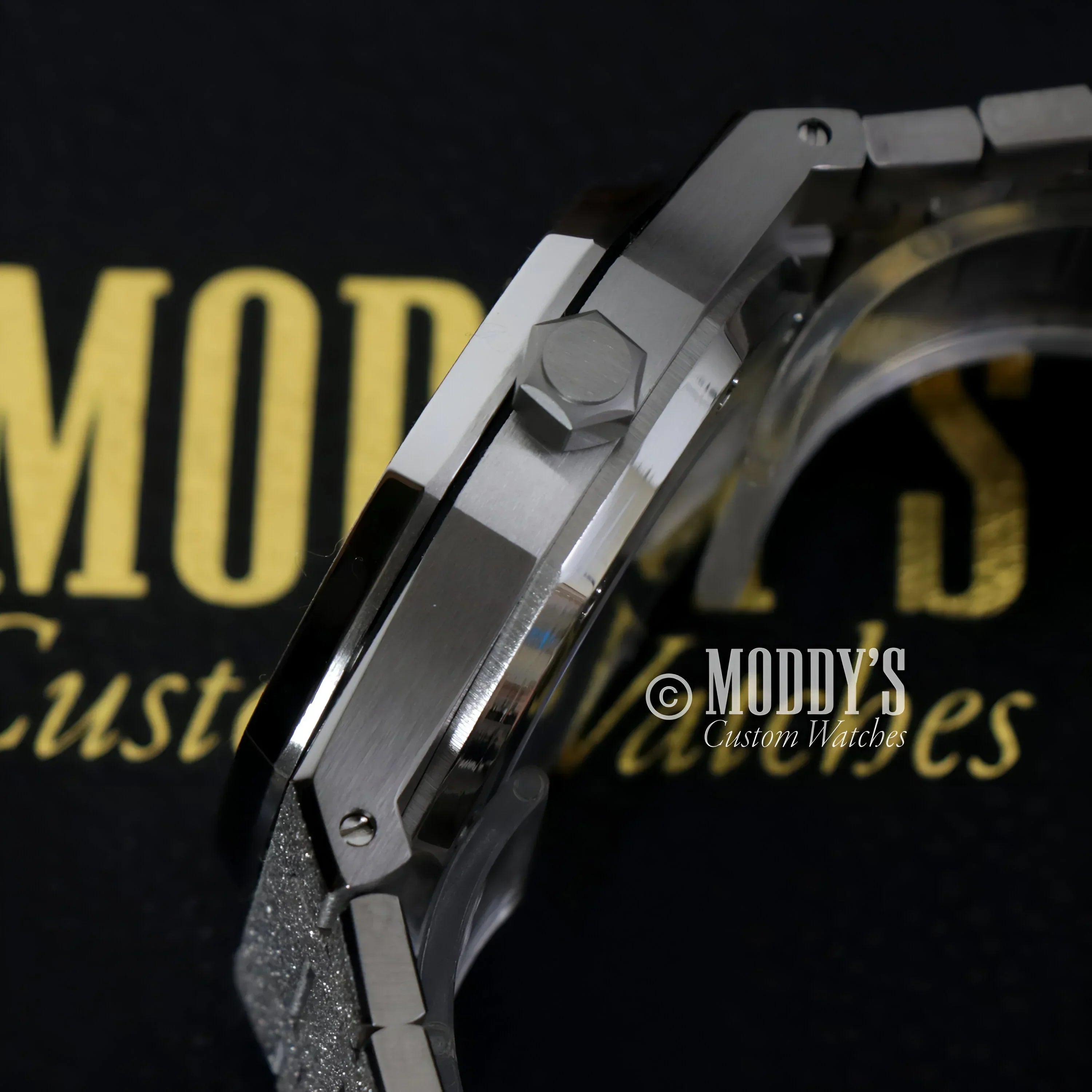Silver wristwatch with hexagonal crown in Royal Seikoak featuring NH35 automatic movement