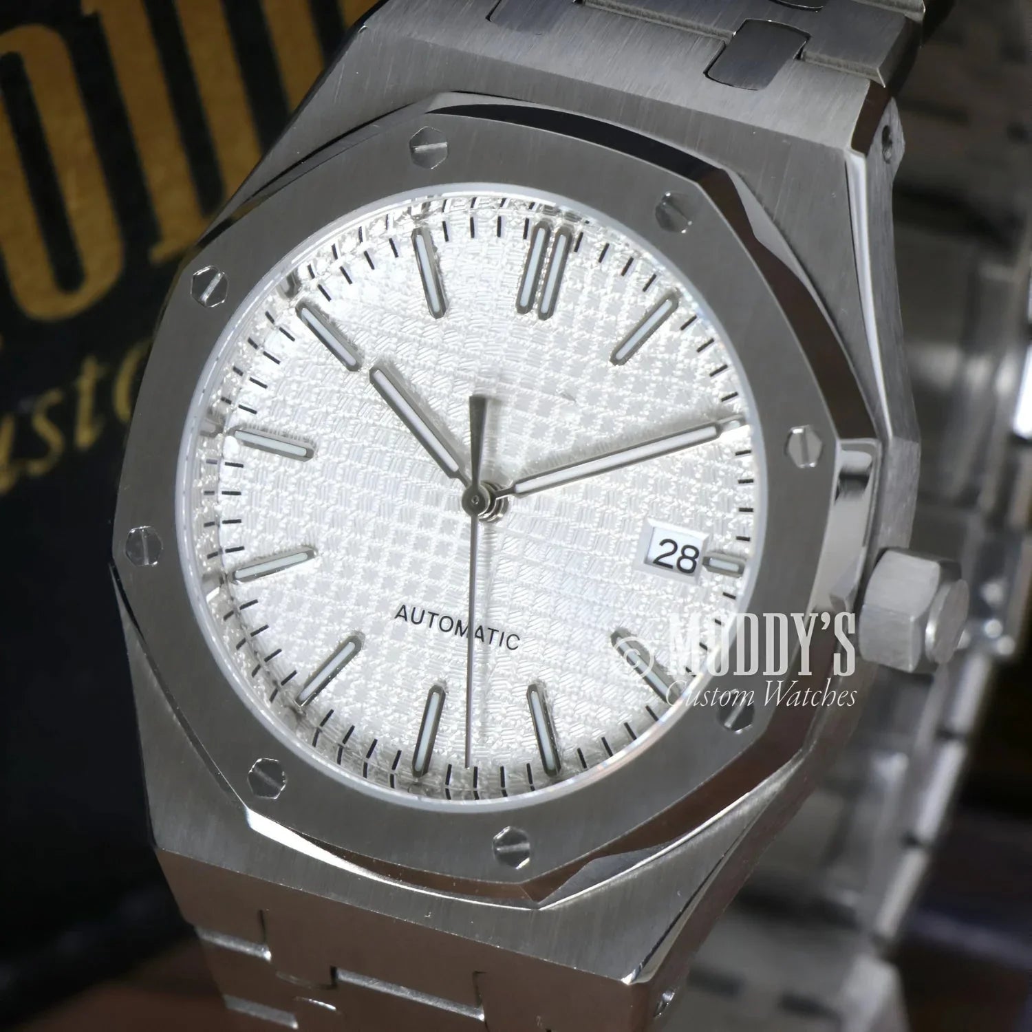 Silver wristwatch with octagonal bezel from Royal Seikoak features NH35 automatic movement