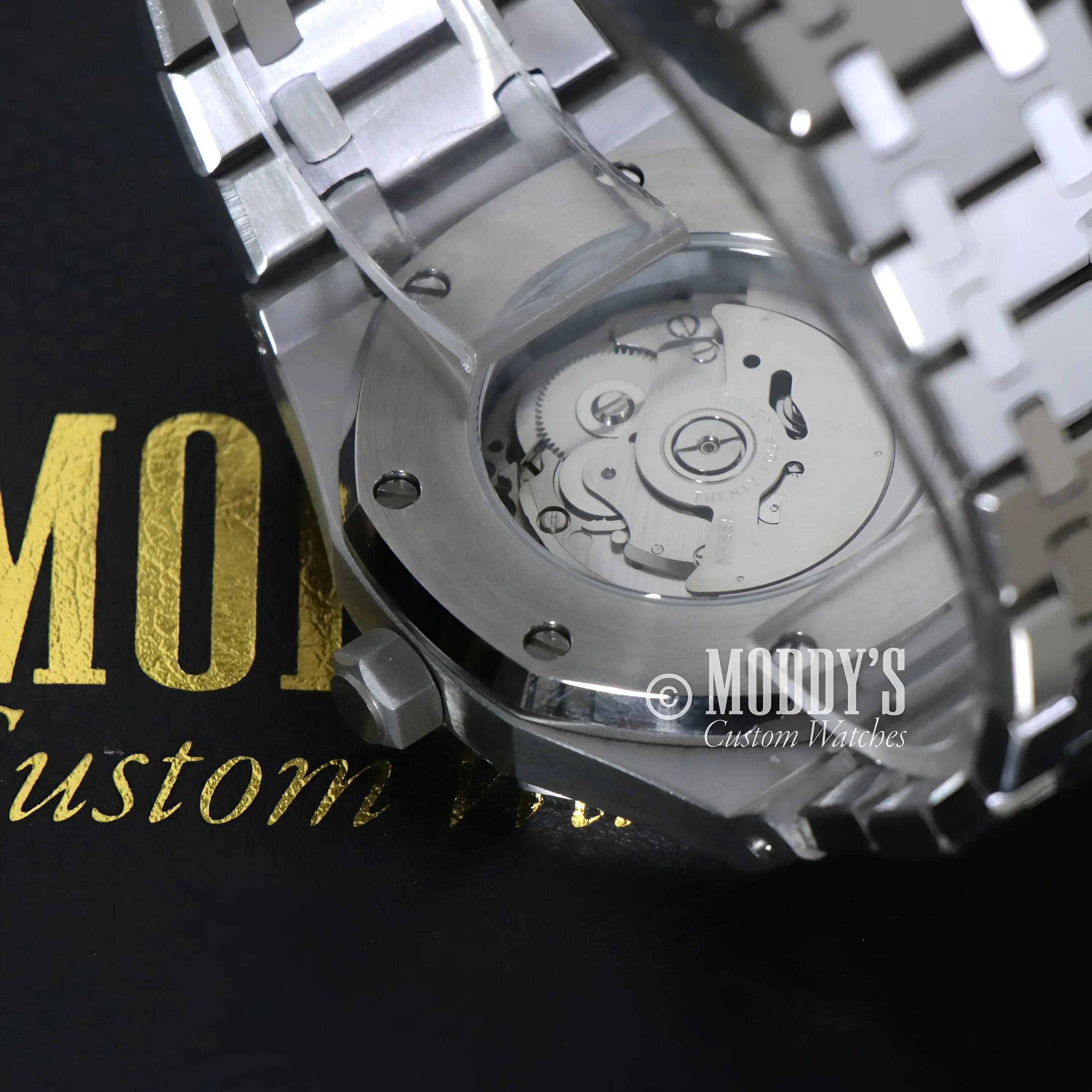 Silver Royal Seikoak wristwatch showcasing NH35 automatic movement and intricate inner workings