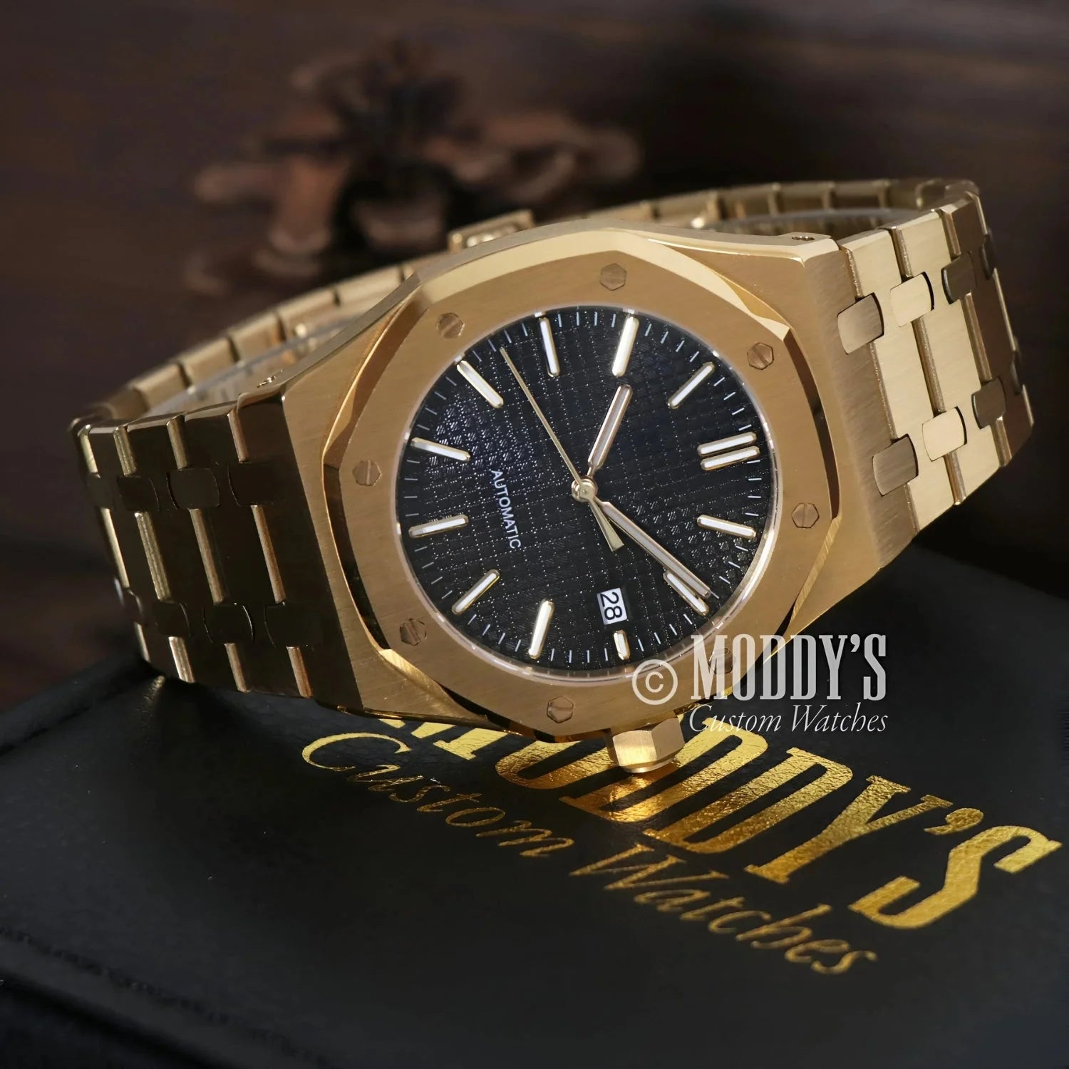 Gold-toned Royal Seikoak wristwatch with black face and NH35 automatic movement