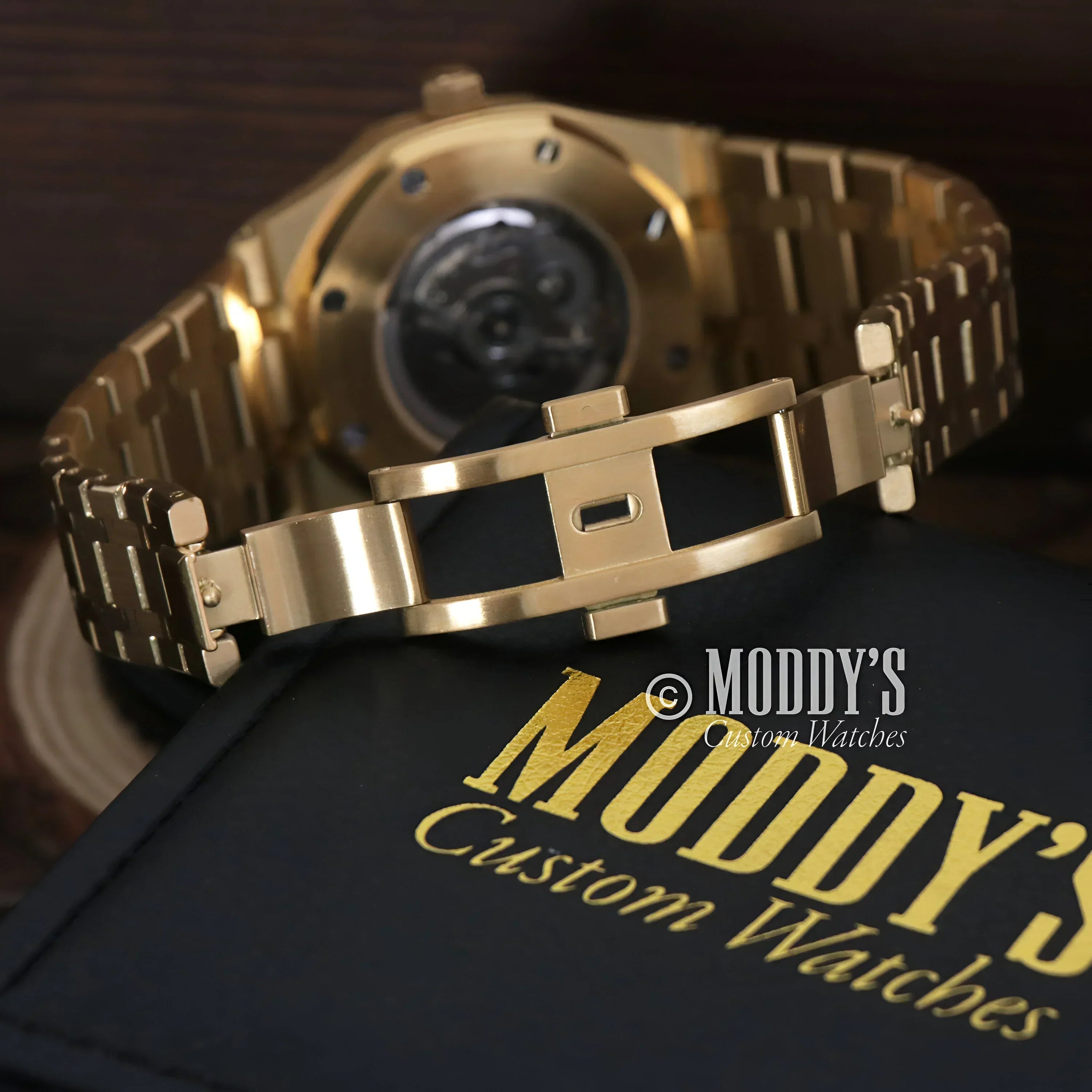 Gold wristwatch with open clasp from the Royal Seikoak featuring NH35 automatic movement