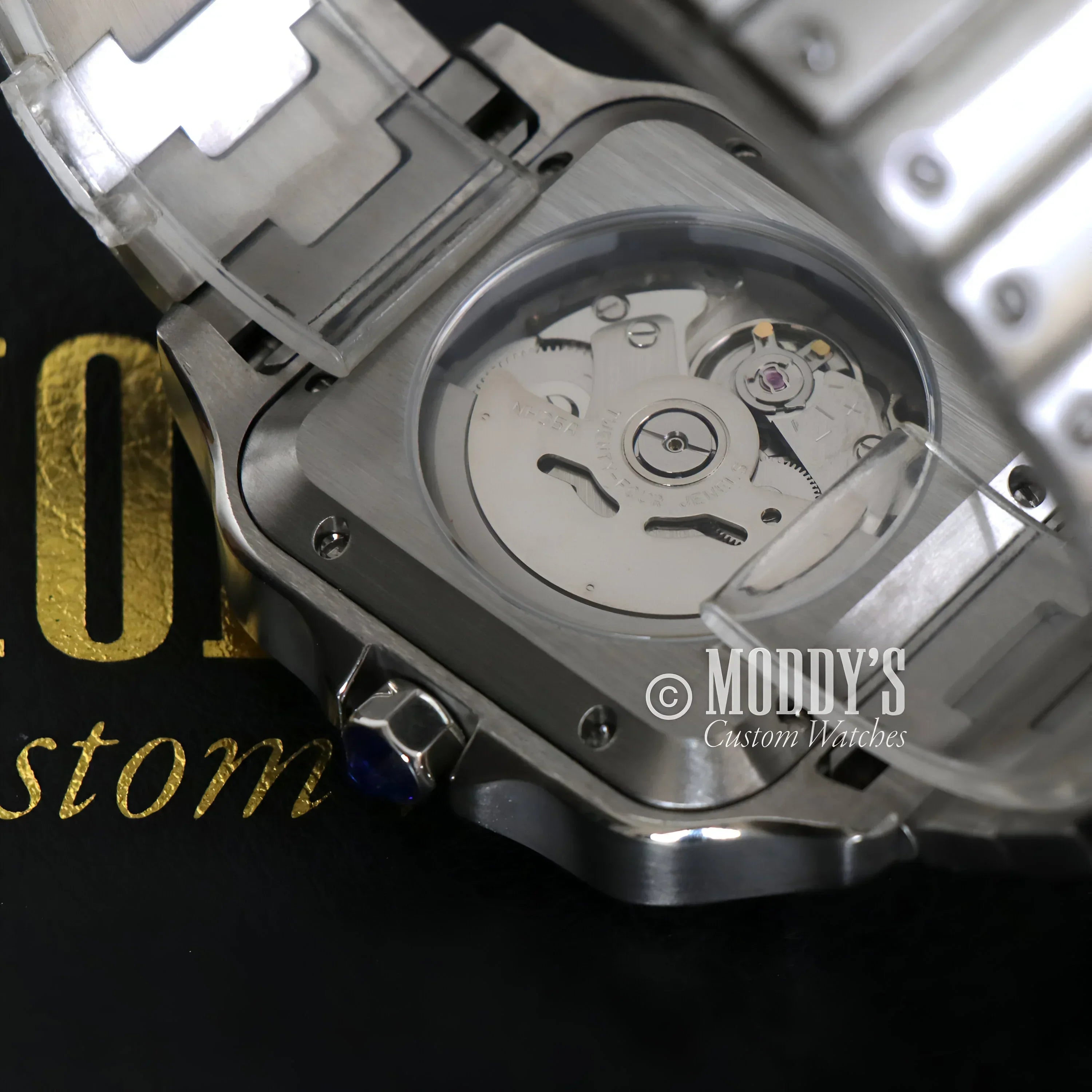 Silver wristwatch with exposed NH35 automatic movement in Arabic White design