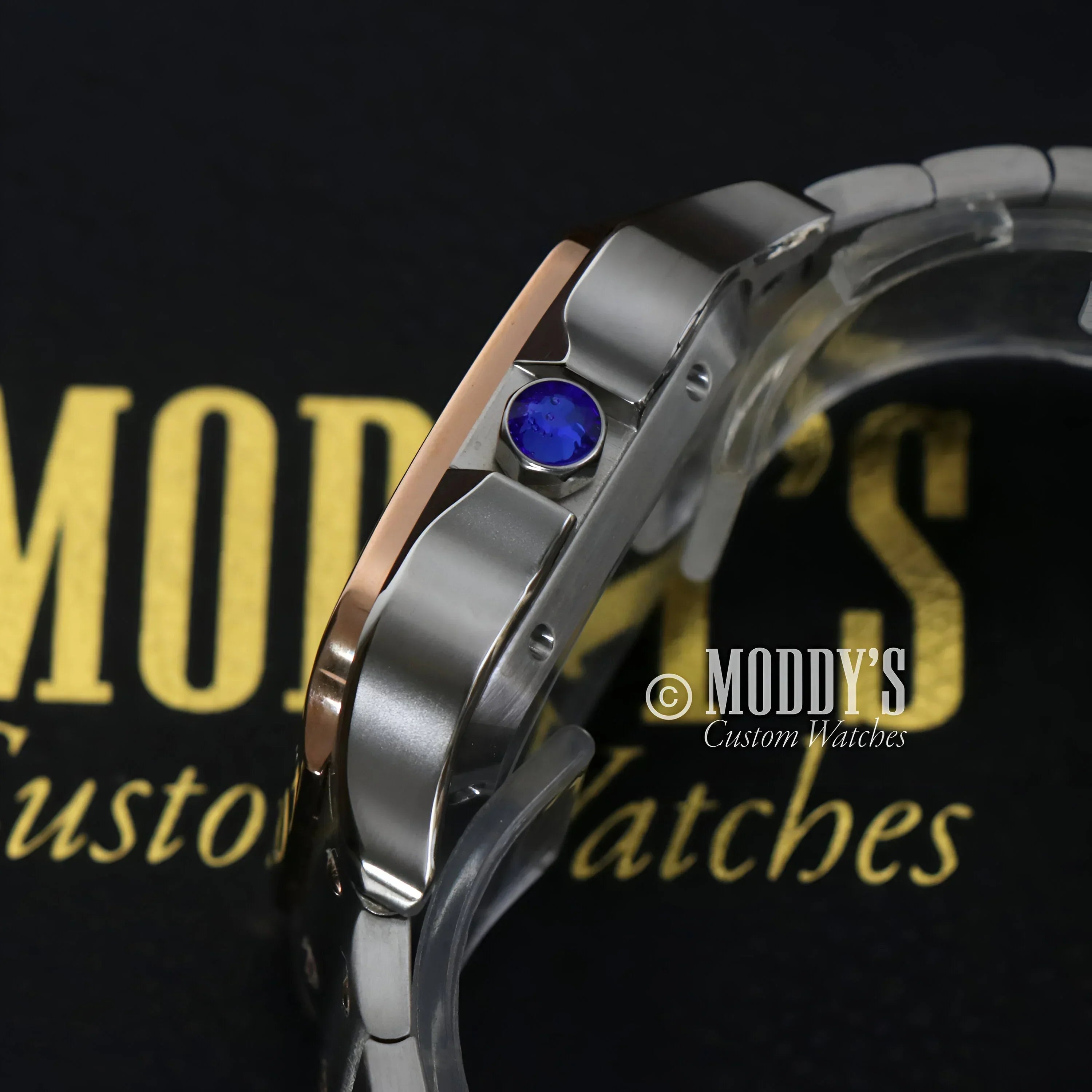 Silver and rose gold watch with blue jewel, featuring NH35 automatic movement