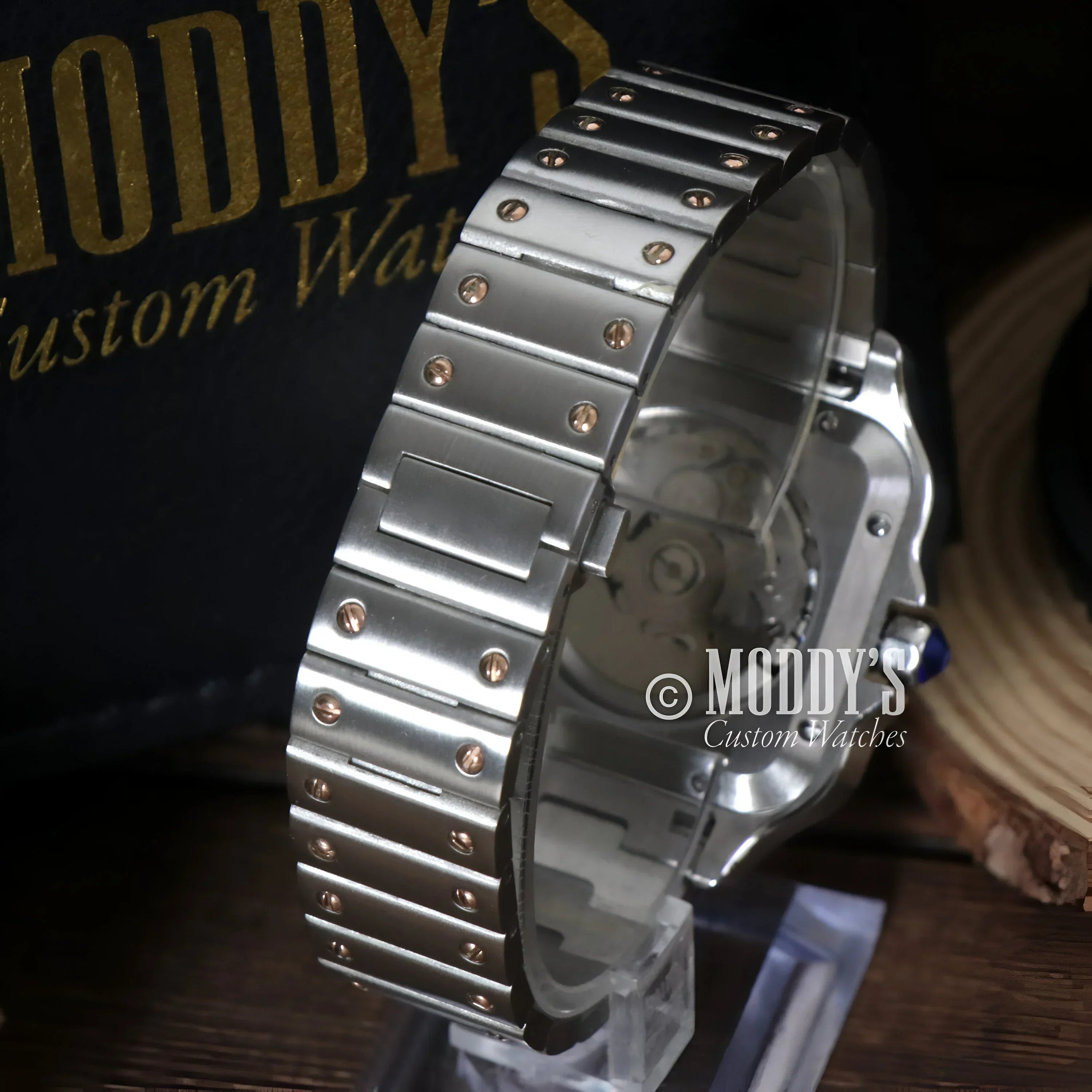 Silver wristwatch with metal band featuring NH35 automatic movement in Seiko Mod Santos style