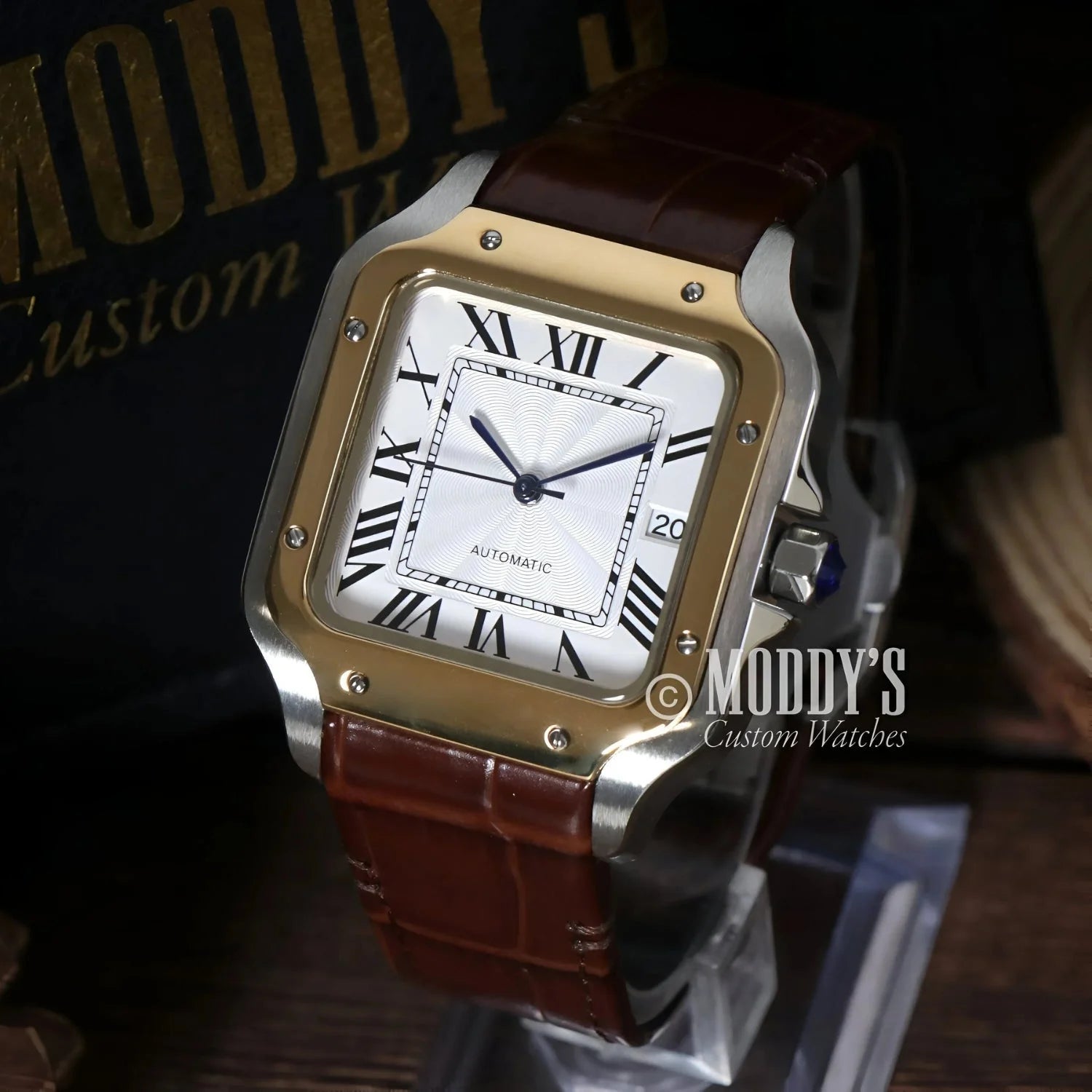 Gold and silver wristwatch with brown leather band featuring Seiko NH35 automatic movement