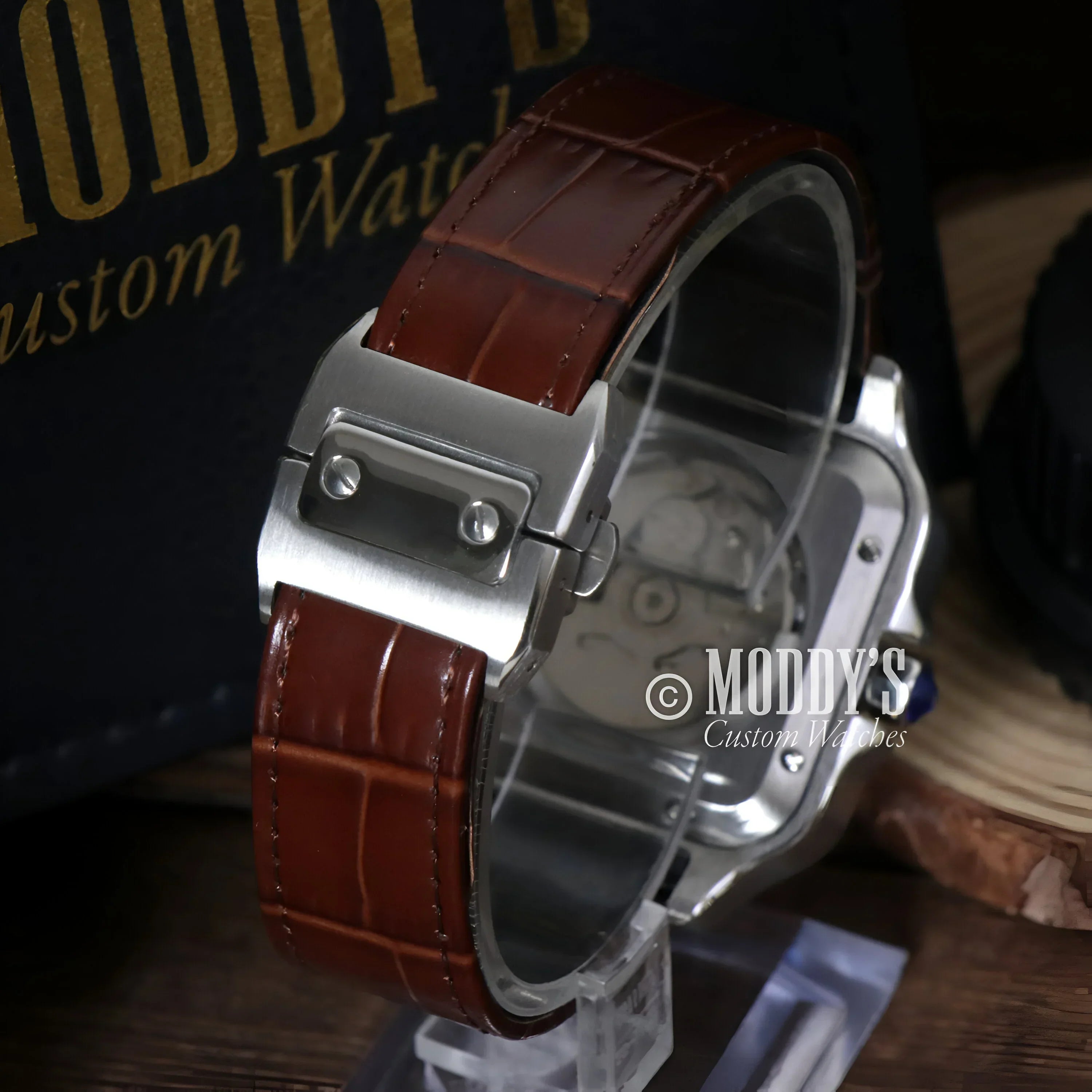 Silver watch with brown leather band featuring Seiko NH35 automatic movement