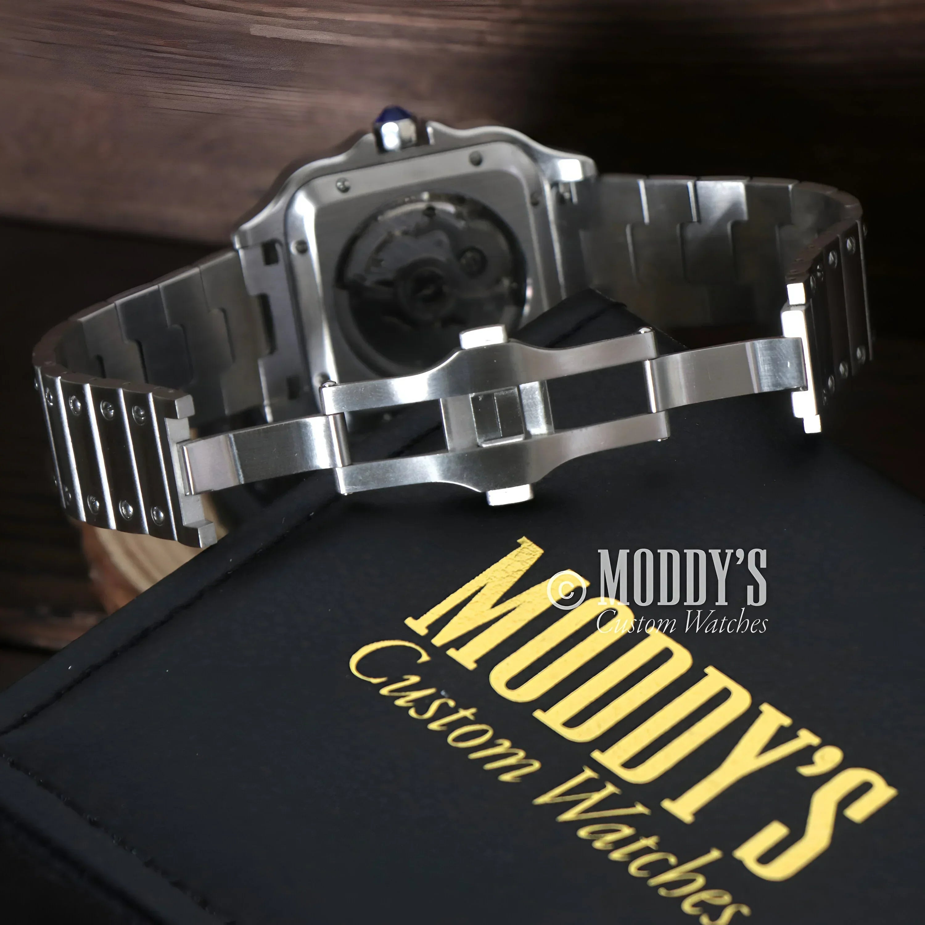 Silver wristwatch with metal band featuring NH70 automatic movement and 316L stainless steel