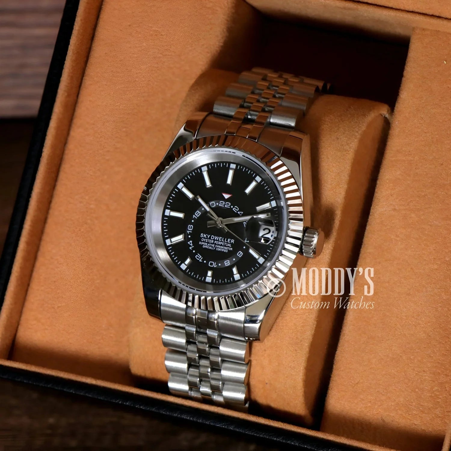 Silver wristwatch with black face, Seikojust Sky Dweller, featuring Seiko NH35 movement