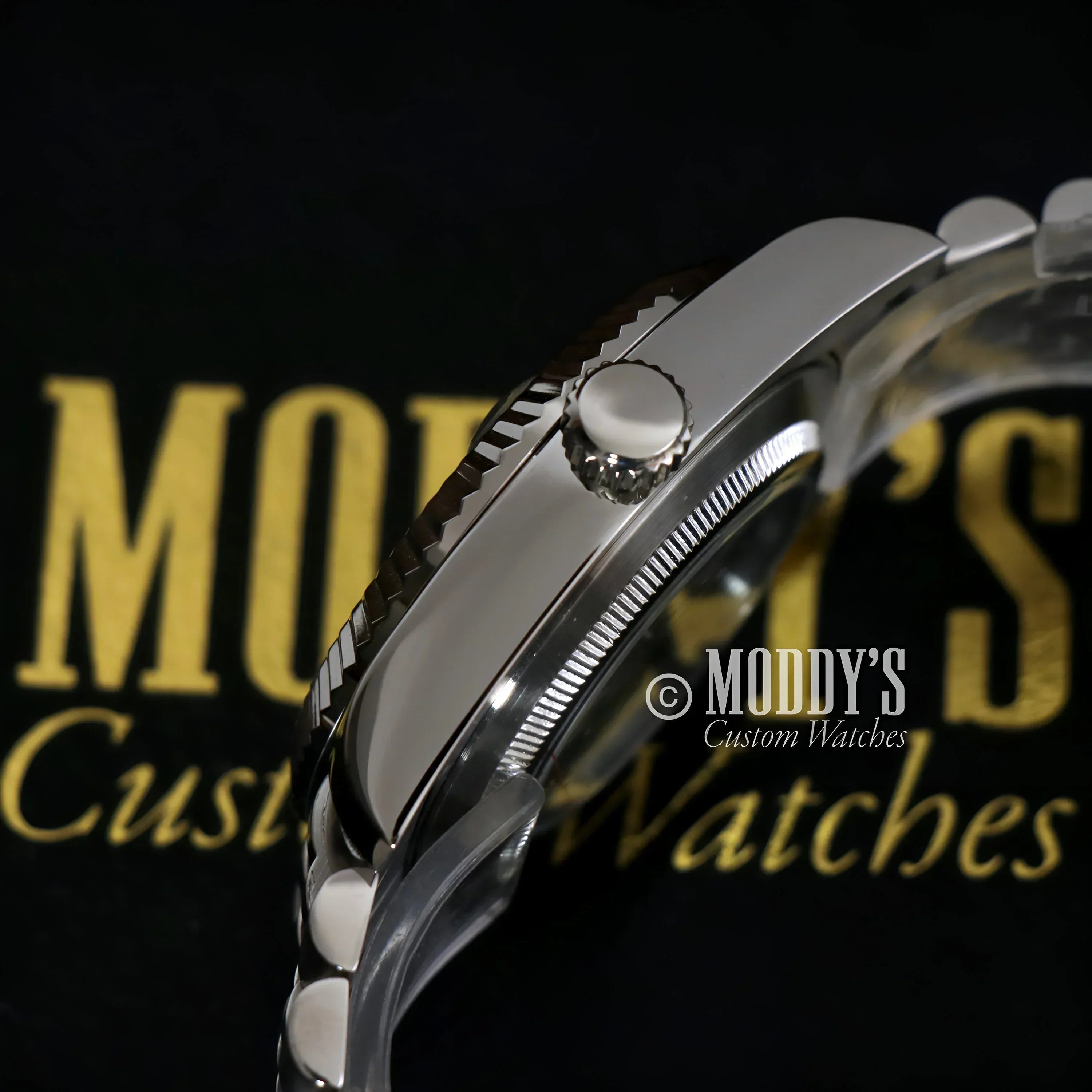 Silver wristwatch with fluted bezel from Seikojust Sky Dweller, featuring Seiko NH35 movement