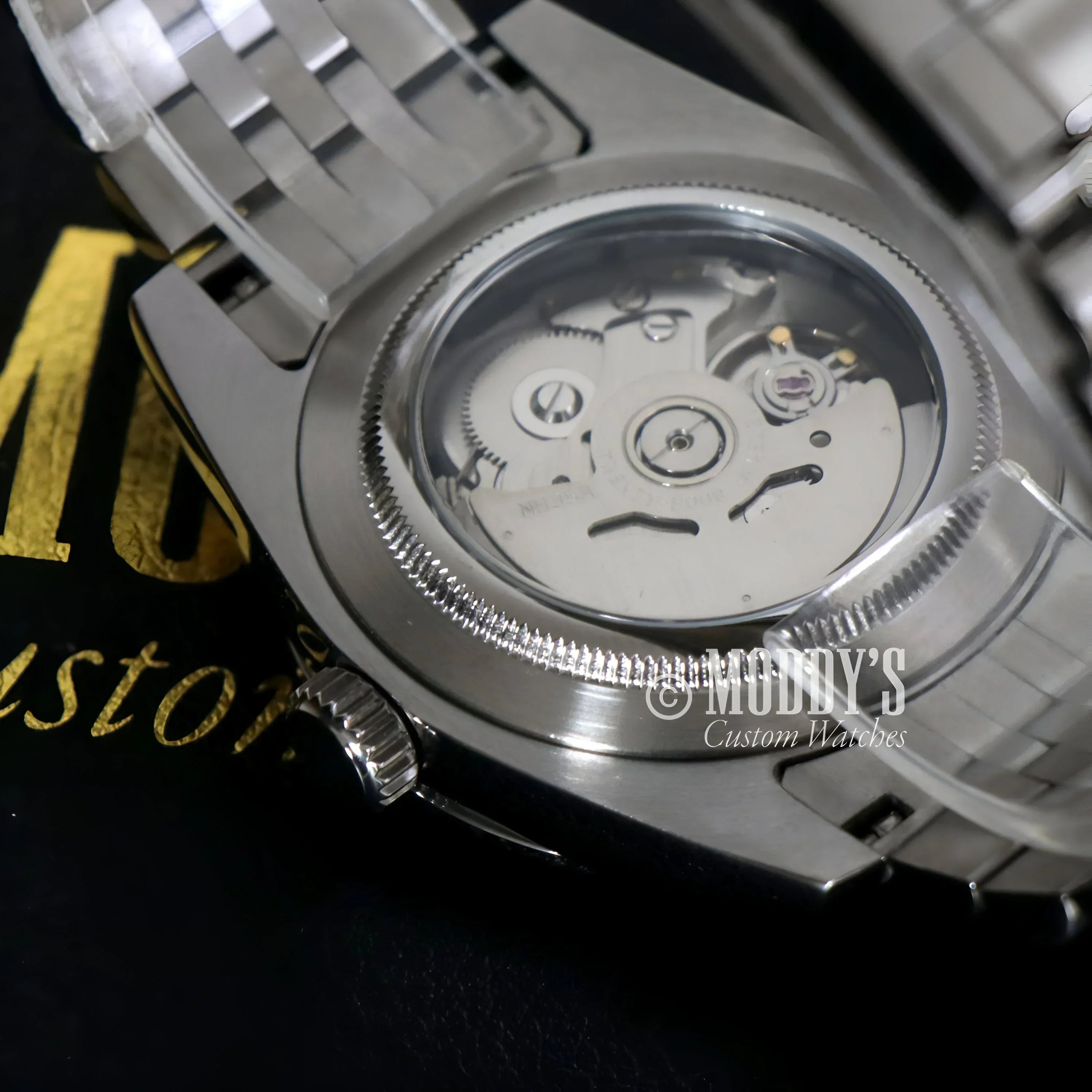 Silver Seikojust Sky Dweller Black wristwatch with visible gears and 316L stainless steel
