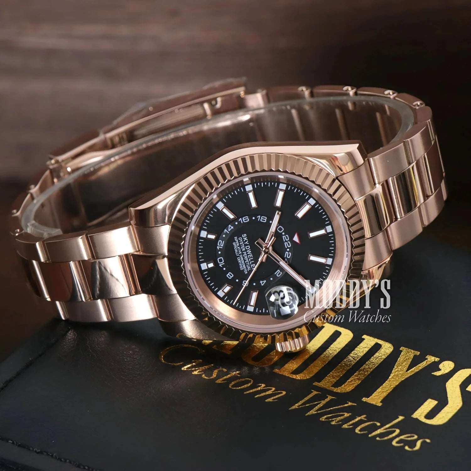 Rose gold wristwatch with black dial from Seikojust Sky Dweller Rose collection