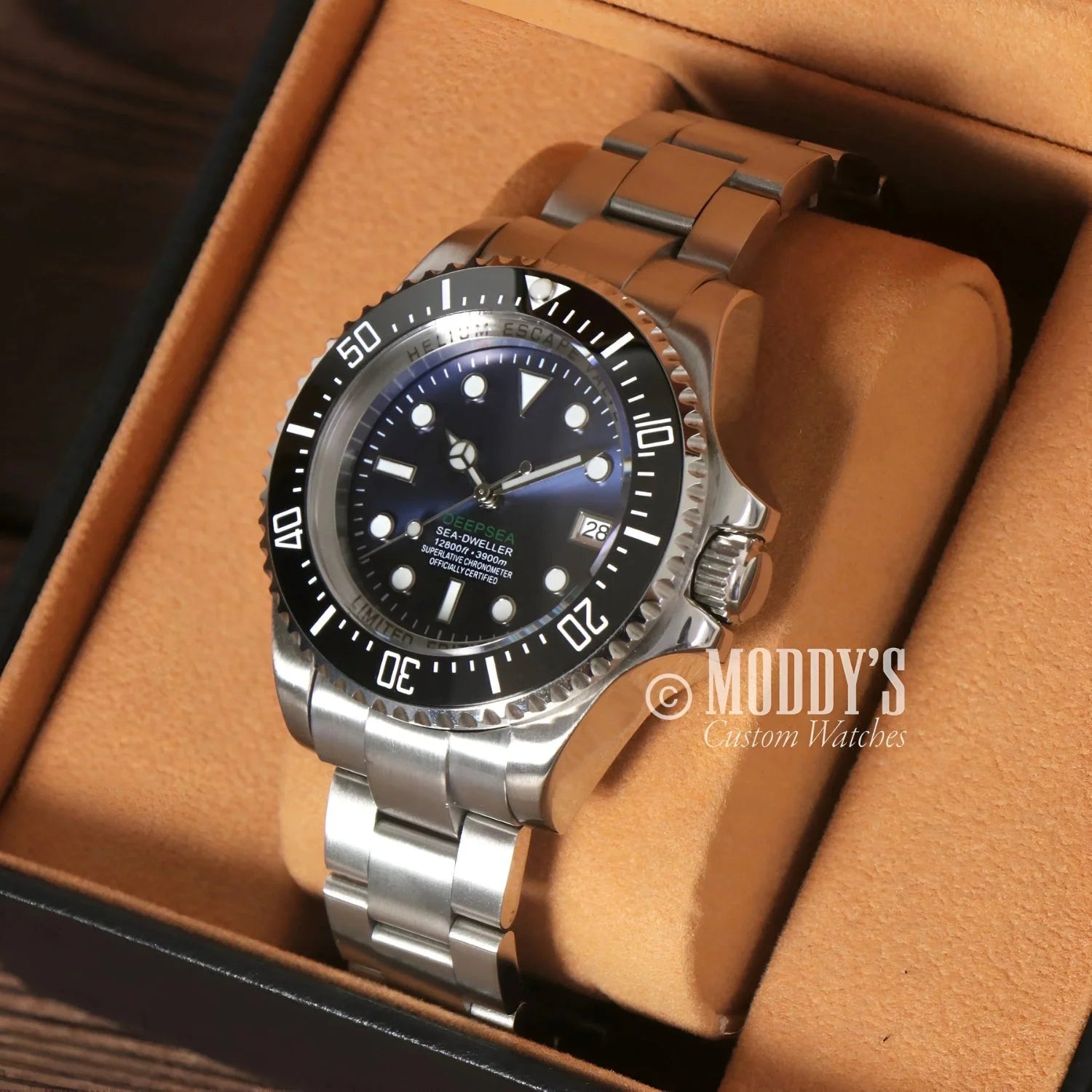 Silver wristwatch with black bezel from Seikomariner Deepsea, featuring Seiko NH35 automatic
