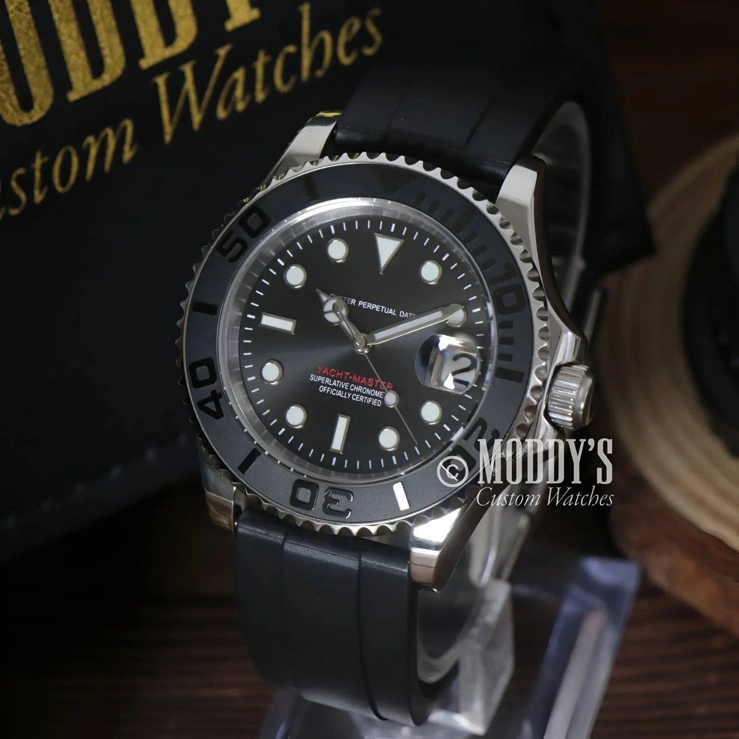 Black-faced Seikomariner wristwatch with black band and NH35 automatic movement