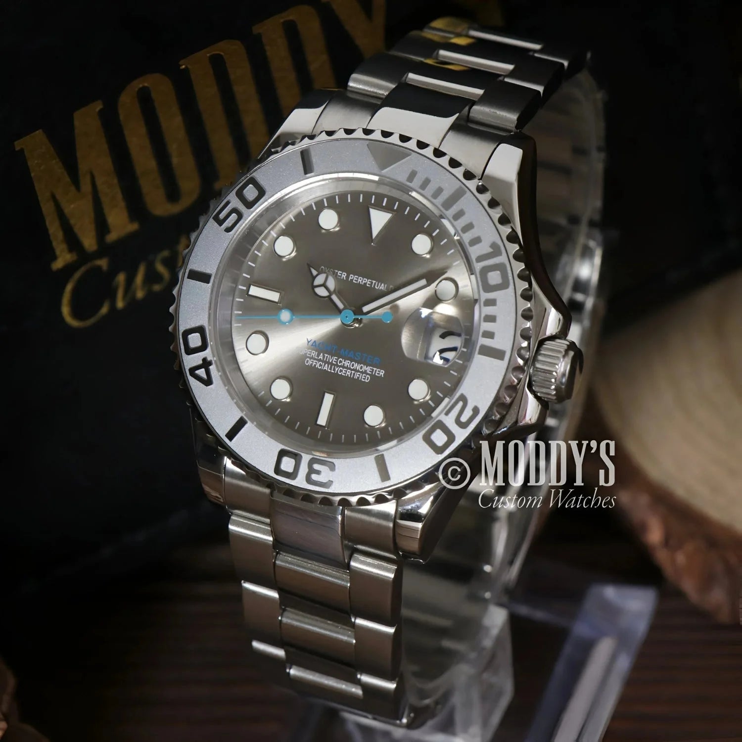 Silver wristwatch with gray face featuring Seiko mod and NH35 automatic movement