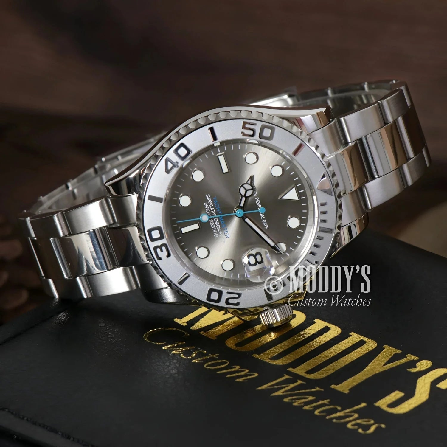 Silver wristwatch with gray face featuring NH35 automatic movement and 316L stainless steel