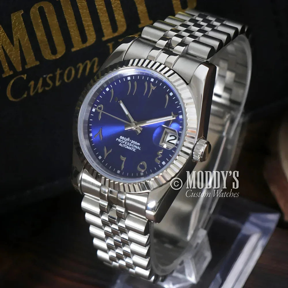 Silver wristwatch with blue face, Seikojust Arabic Royal Blue, featuring Seiko NH35 automatic