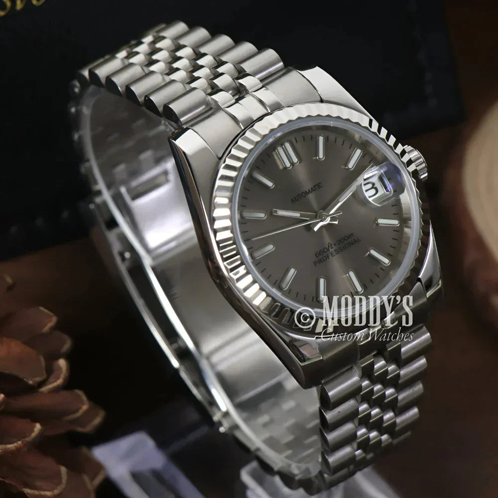 Silver wristwatch with fluted bezel from Seikojust Champagne featuring Seiko NH35 automatic