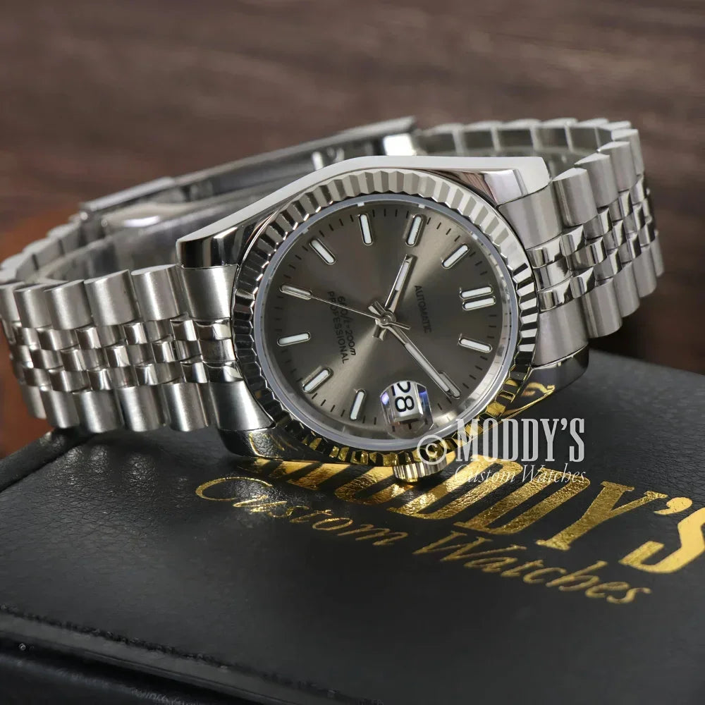 Silver wristwatch with gray face featuring Seiko NH35 automatic and Seiko mod Datejust design