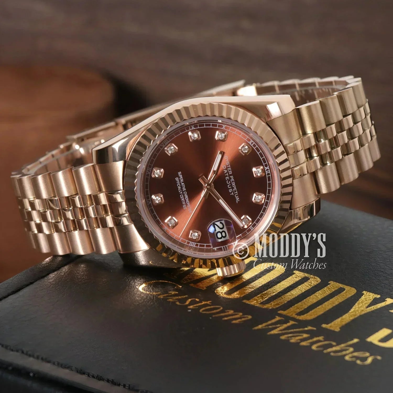 Rose gold wristwatch with diamond hour markers from Seikojust Chocolate Crystals collection