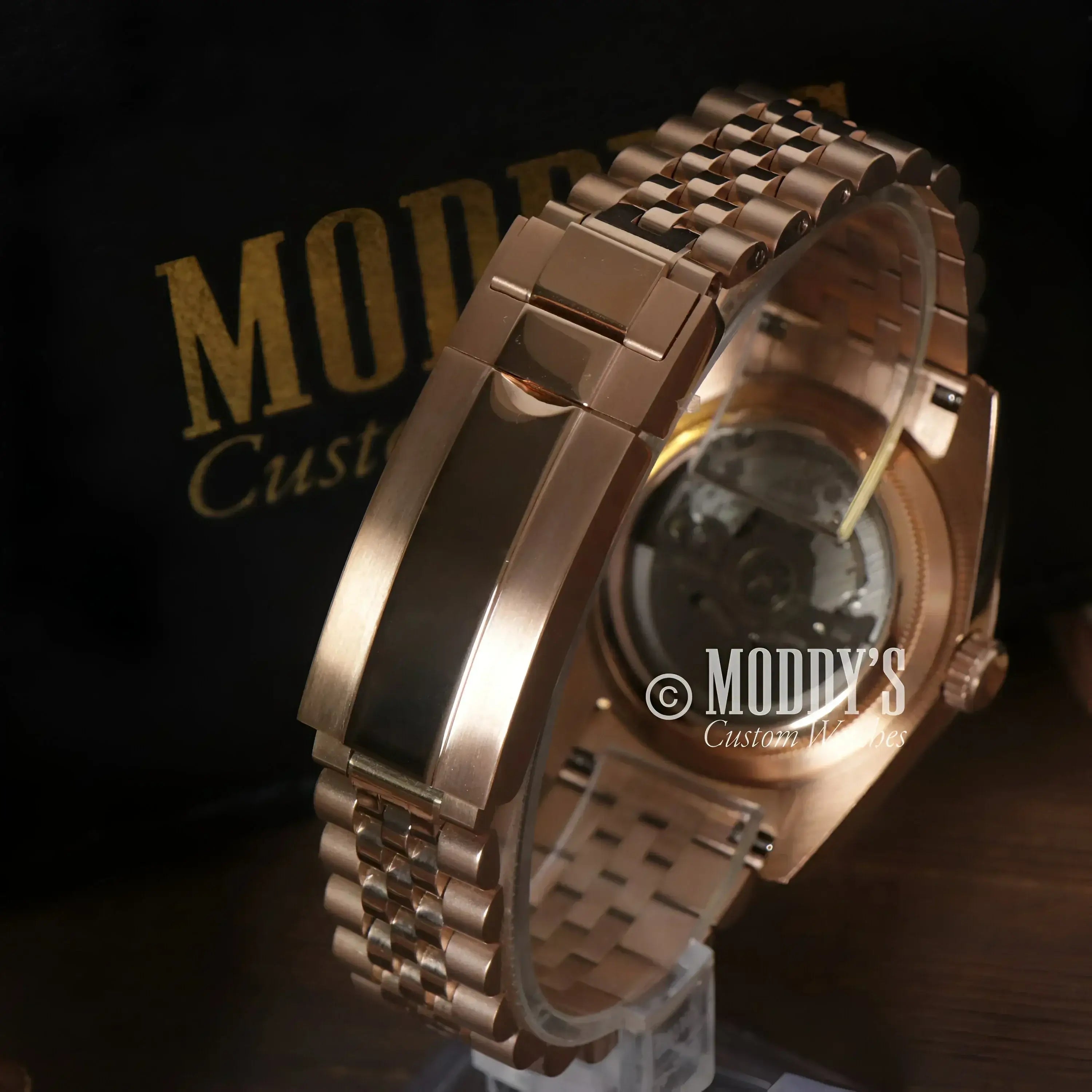 Rose gold Seiko Mod wristwatch with visible movement and chocolate crystals design