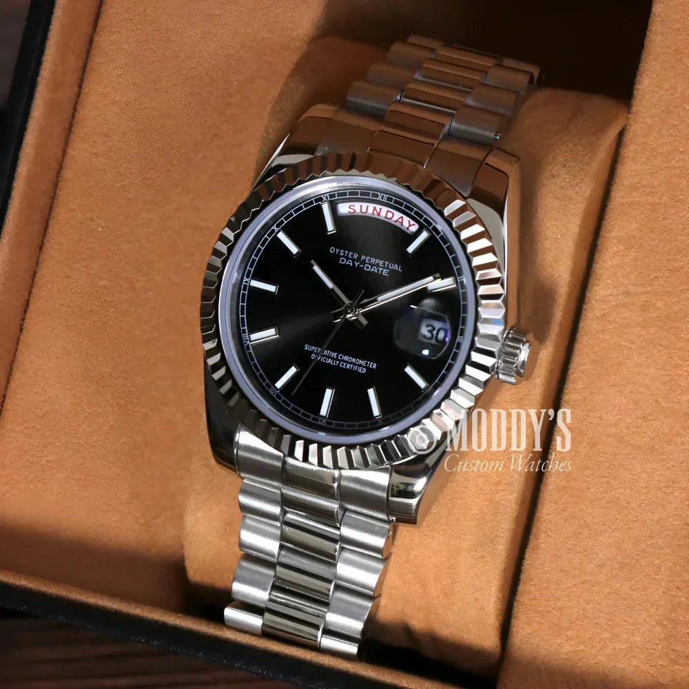 Silver wristwatch with black face from Seikojust Daydate Classic Black in 904L stainless steel