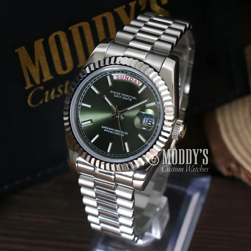 Silver wristwatch featuring a green face from Seikojust Daydate Mint Green collection