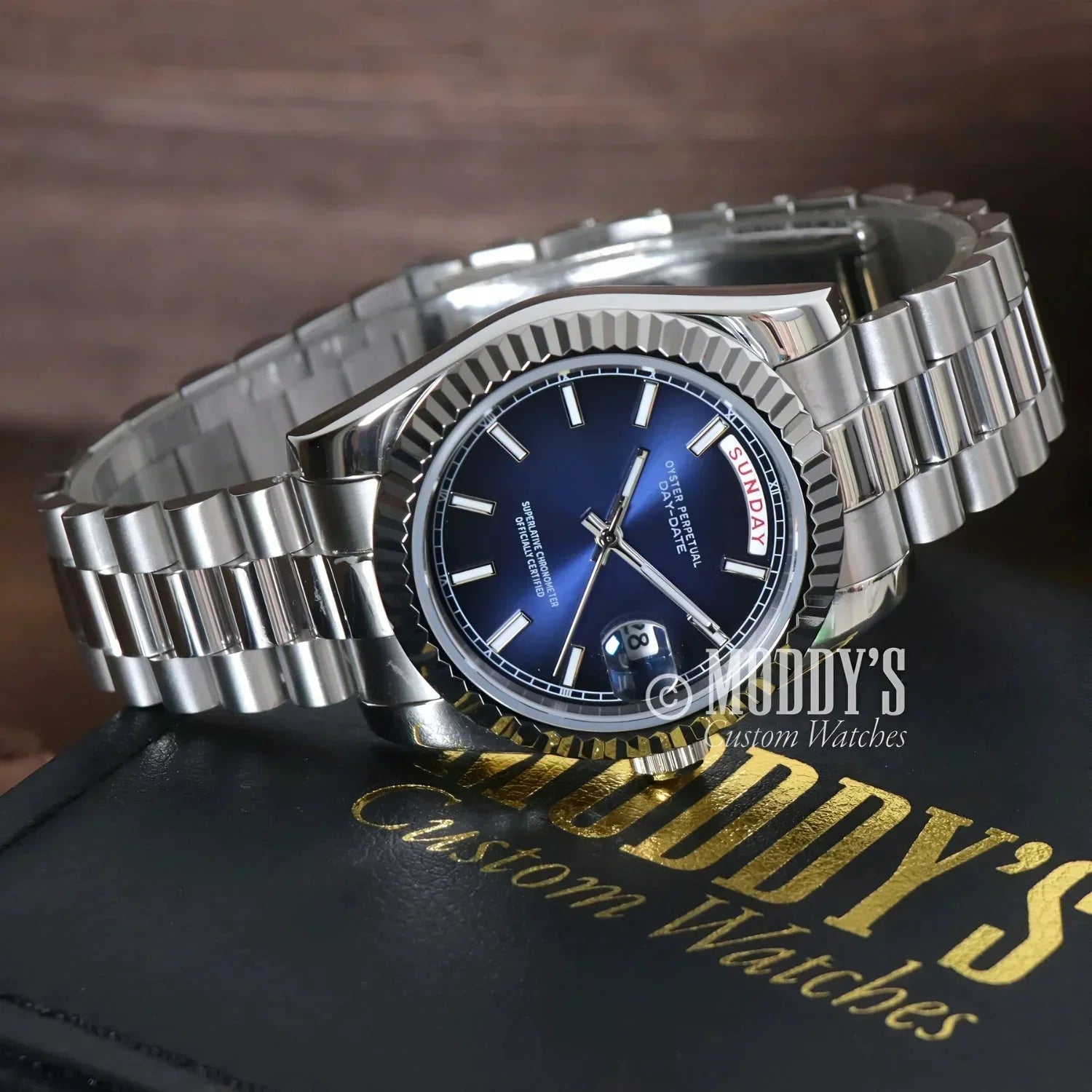 Silver wristwatch with blue face from Seikojust Daydate Royal Blue in 904L stainless steel