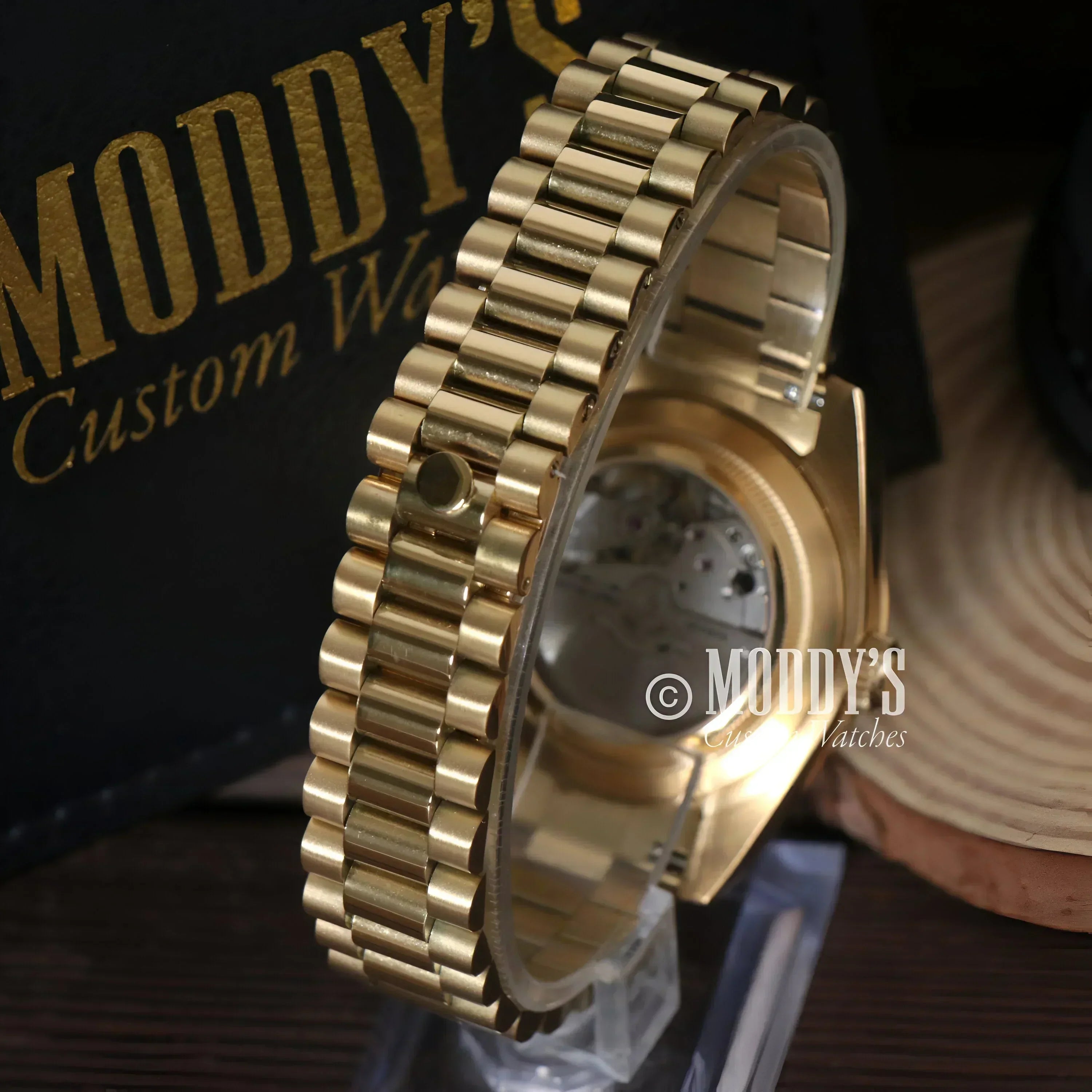 Gold watch with exposed movement from Seikojust Daydate Yellow Gold collection