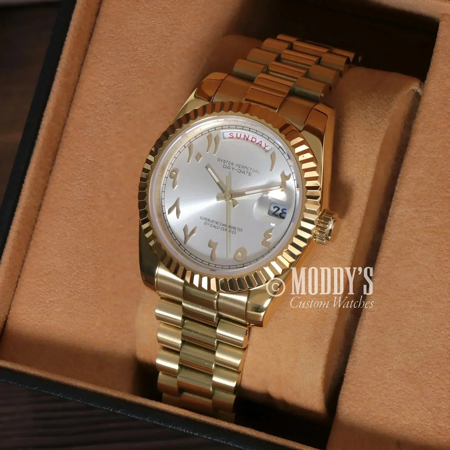 Gold Rolex watch with Arabic numerals in Seikojust Daydate Yellow Gold design