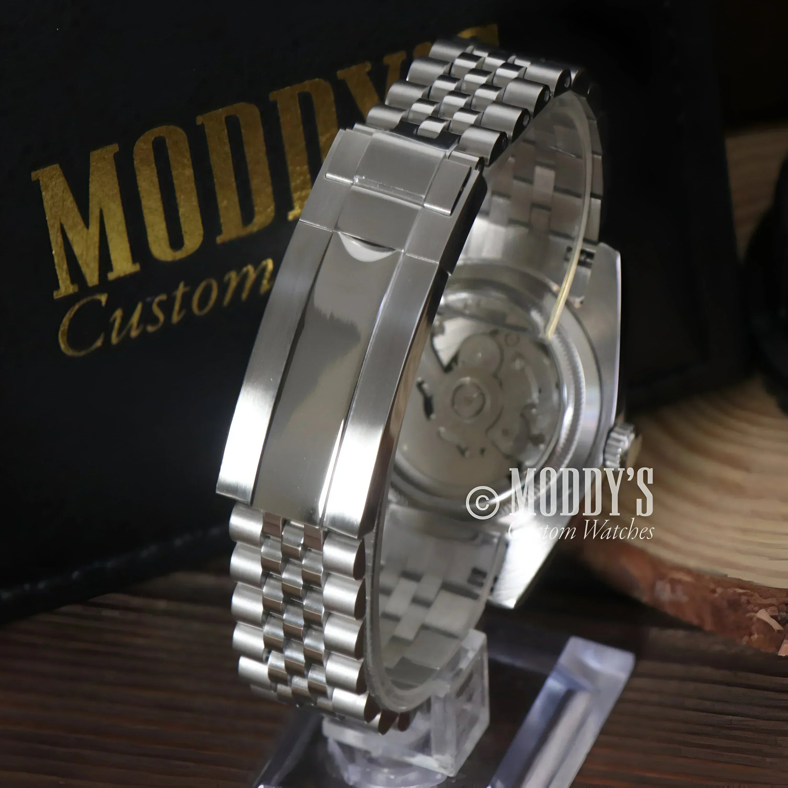 Silver Seikojust Ice Blue Arabic watch featuring a sleek band and NH35 automatic movement