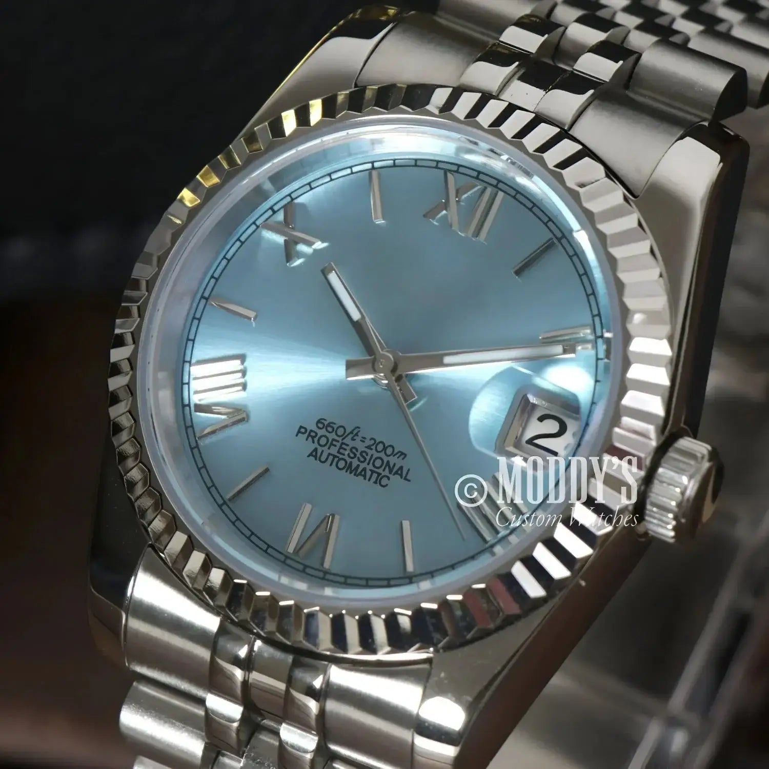 Silver wristwatch with light blue face, Seiko Mod Datejust Ice Blue Roman, NH35 automatic movement