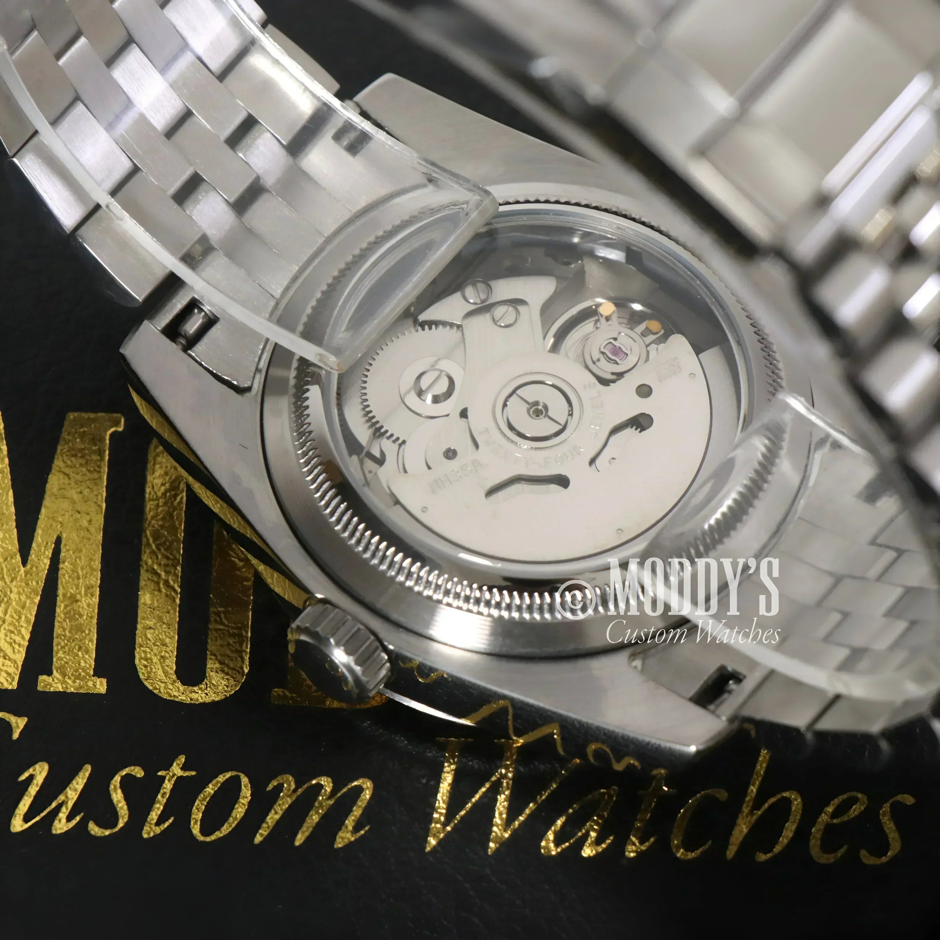 Silver Seiko Mod wristwatch with exposed movement and Mint Green design