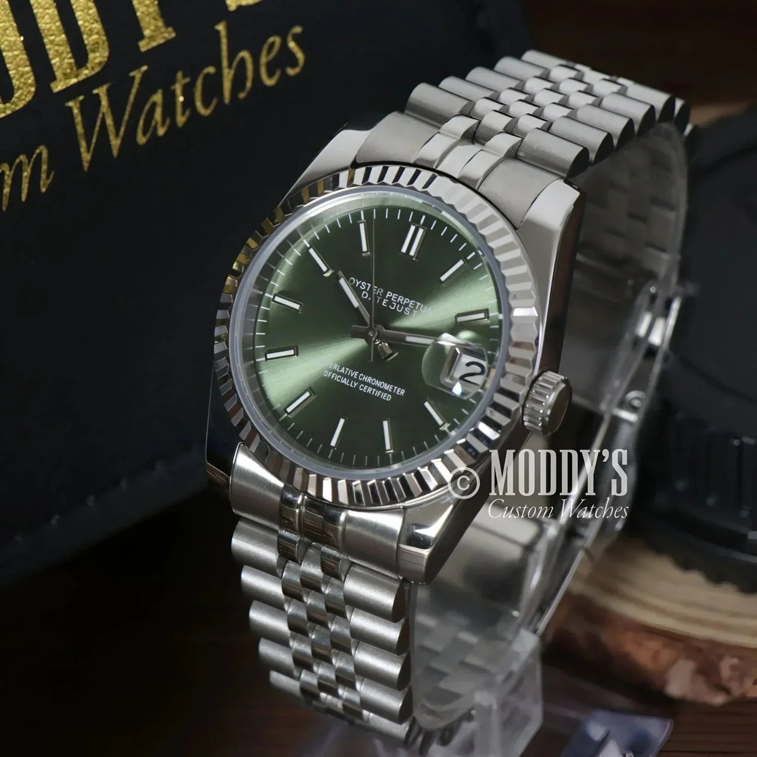 Silver Seiko Mod wristwatch with mint green face and Seiko NH35 automatic movement