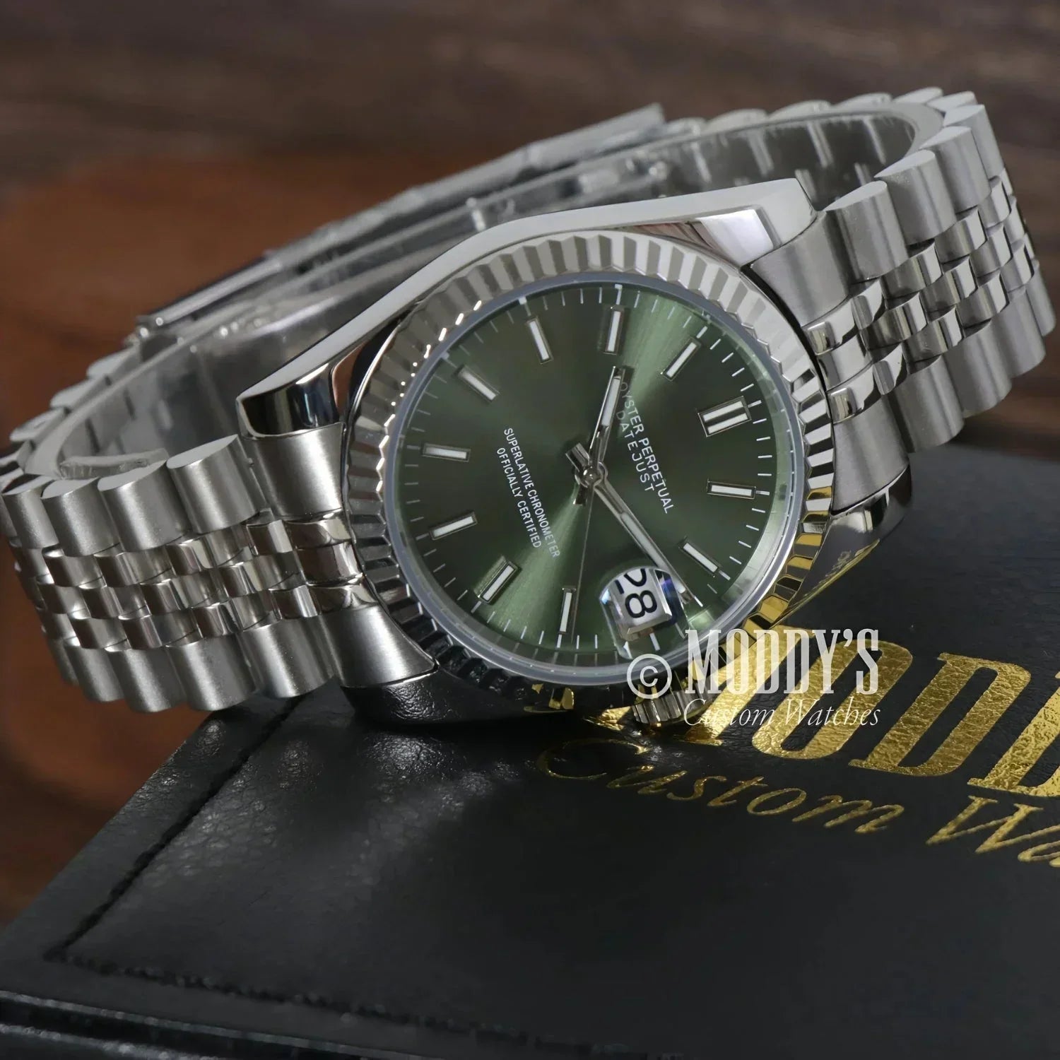 Silver Seiko mod wristwatch with mint green face in Seiko NH35 Automatic style