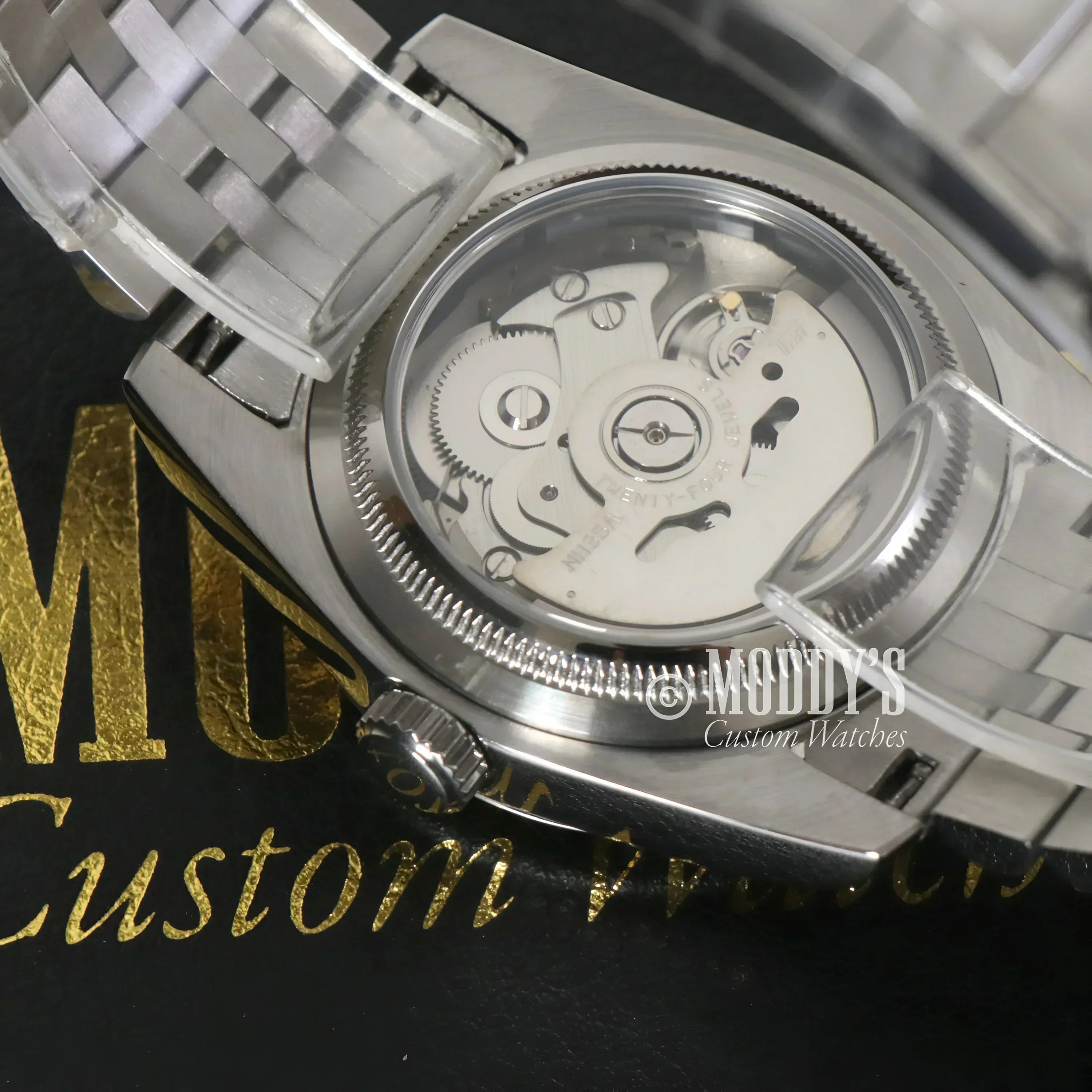 Silver wristwatch with exposed movement, featuring Seiko NH35 automatic in Seikojust Roman Champagne