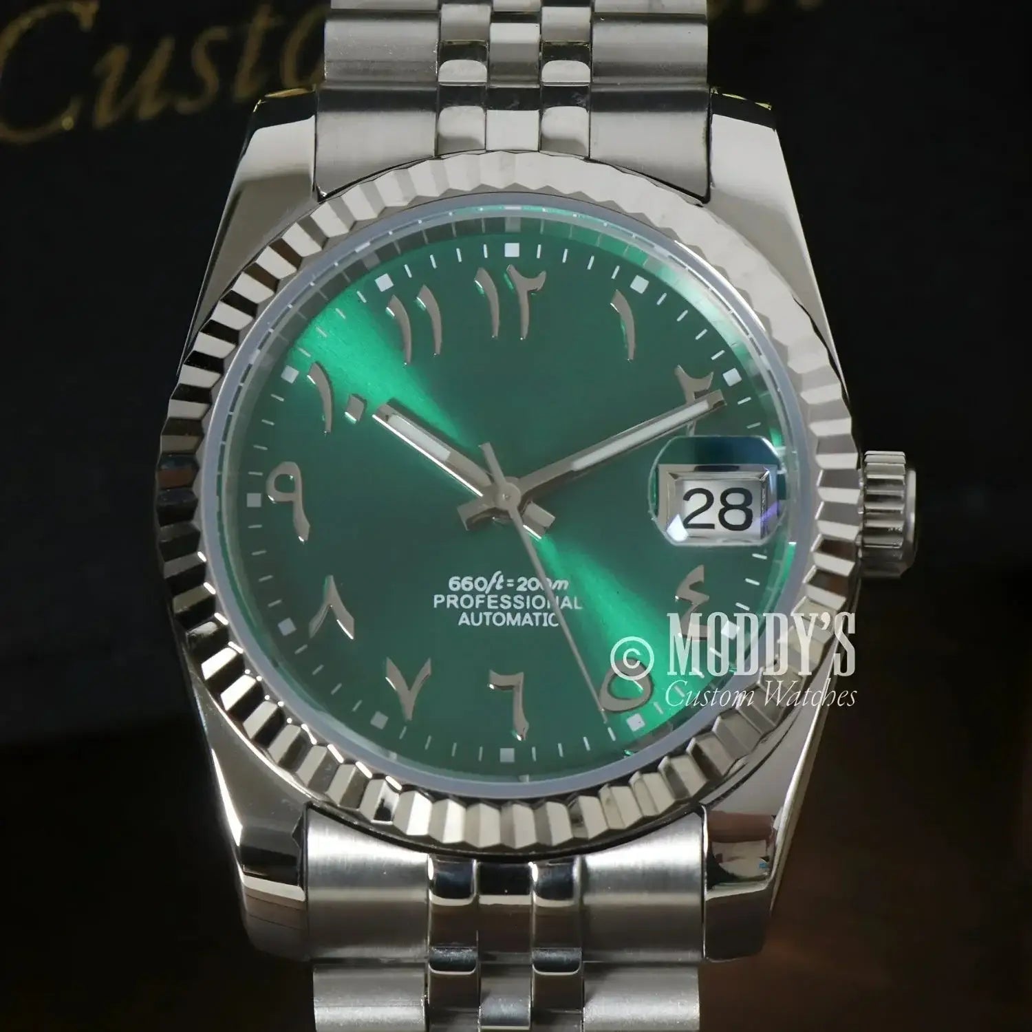 Silver wristwatch featuring a green Arabic numeral face, Seiko Mod Datejust, NH35 automatic movement