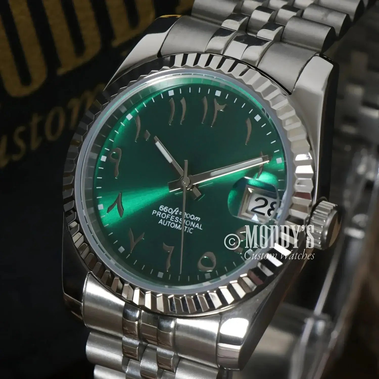Silver wristwatch with green face from Seikojust Royal Green Arabic with NH35 automatic movement