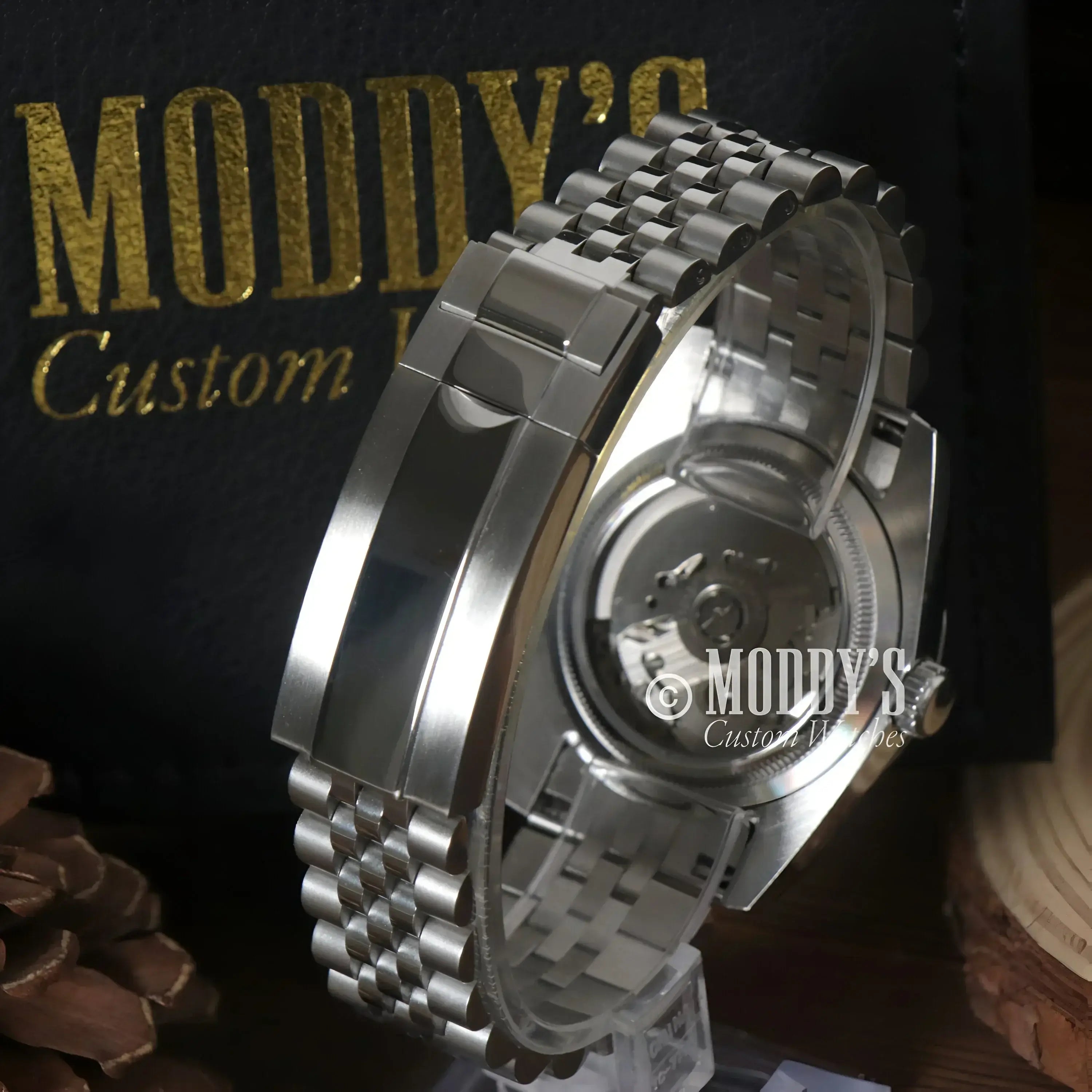 Silver wristwatch showcasing NH35 automatic movement in Seikojust Royal Green Arabic