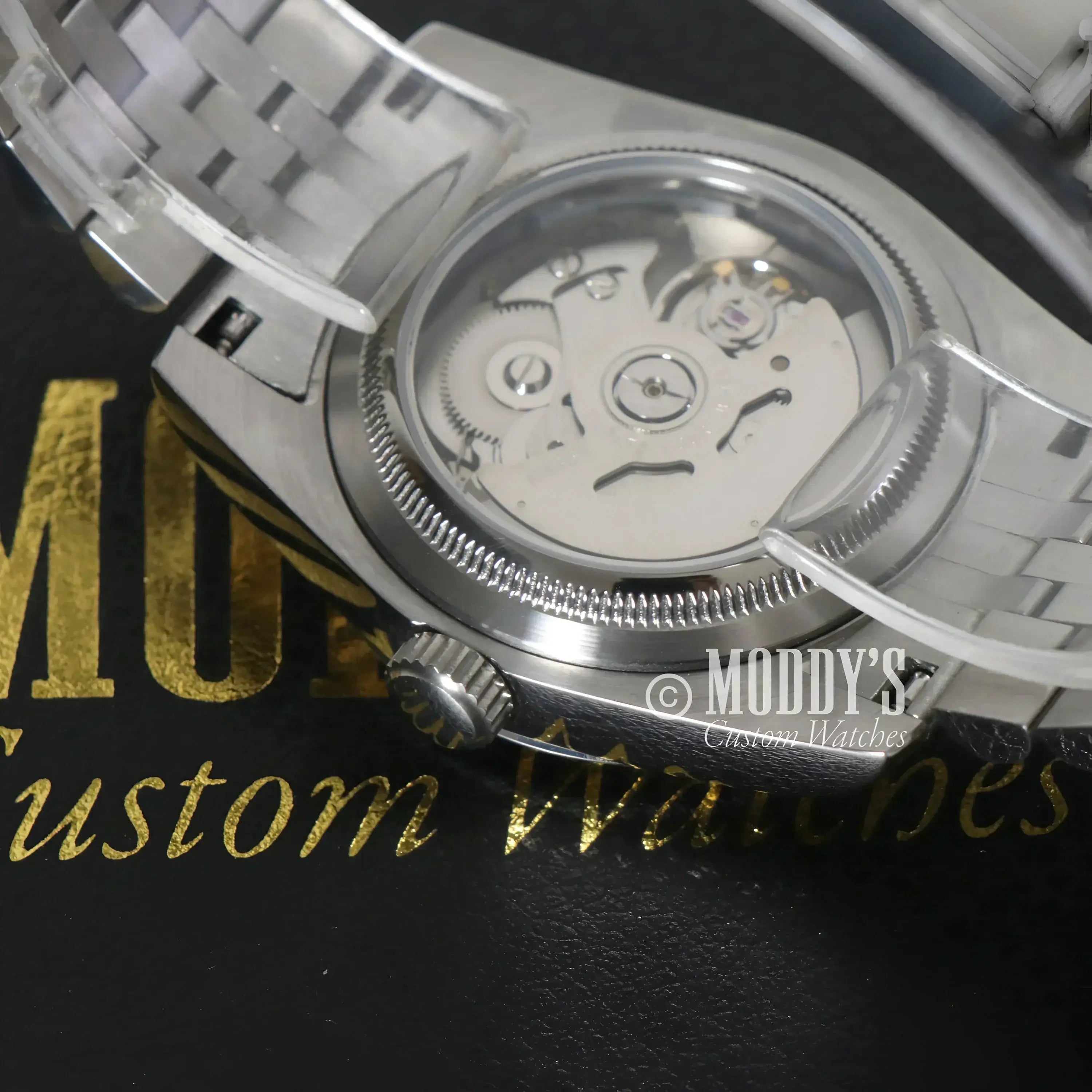 Silver wristwatch with visible NH35 automatic movement, Seiko Mod Datejust, Royal Green Arabic