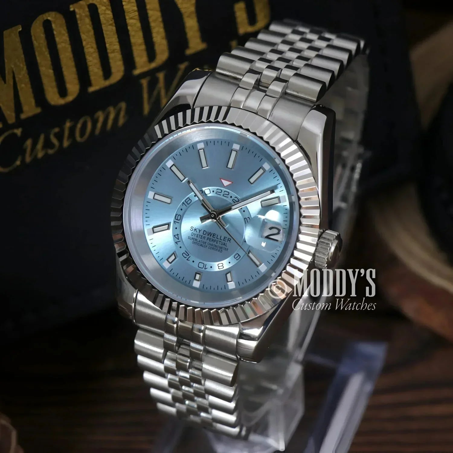 Silver wristwatch with light blue face, Seiko NH35 Automatic, Sky Dweller Ice