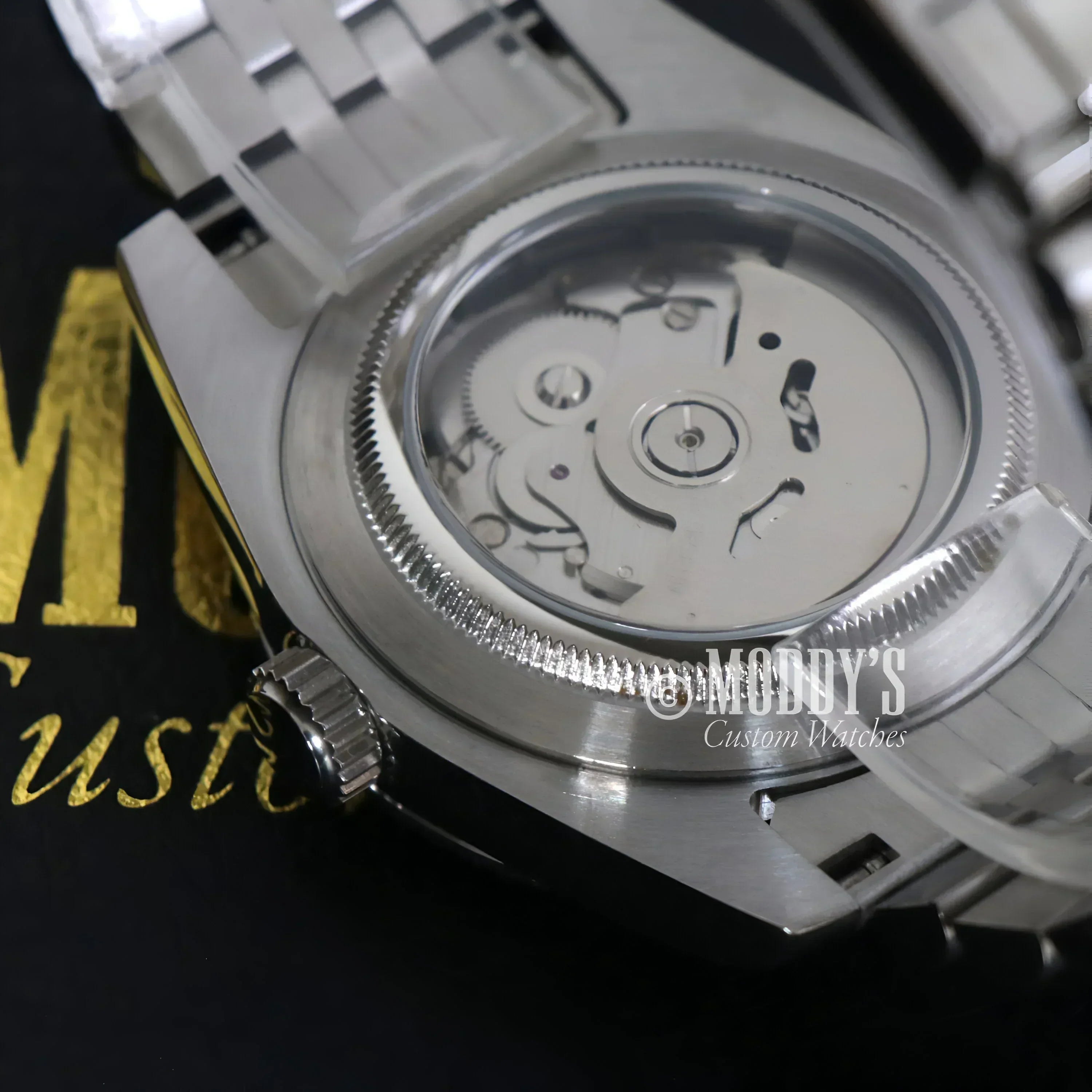 Silver wristwatch with exposed movement from Seikojust Sky Dweller Mint Green collection