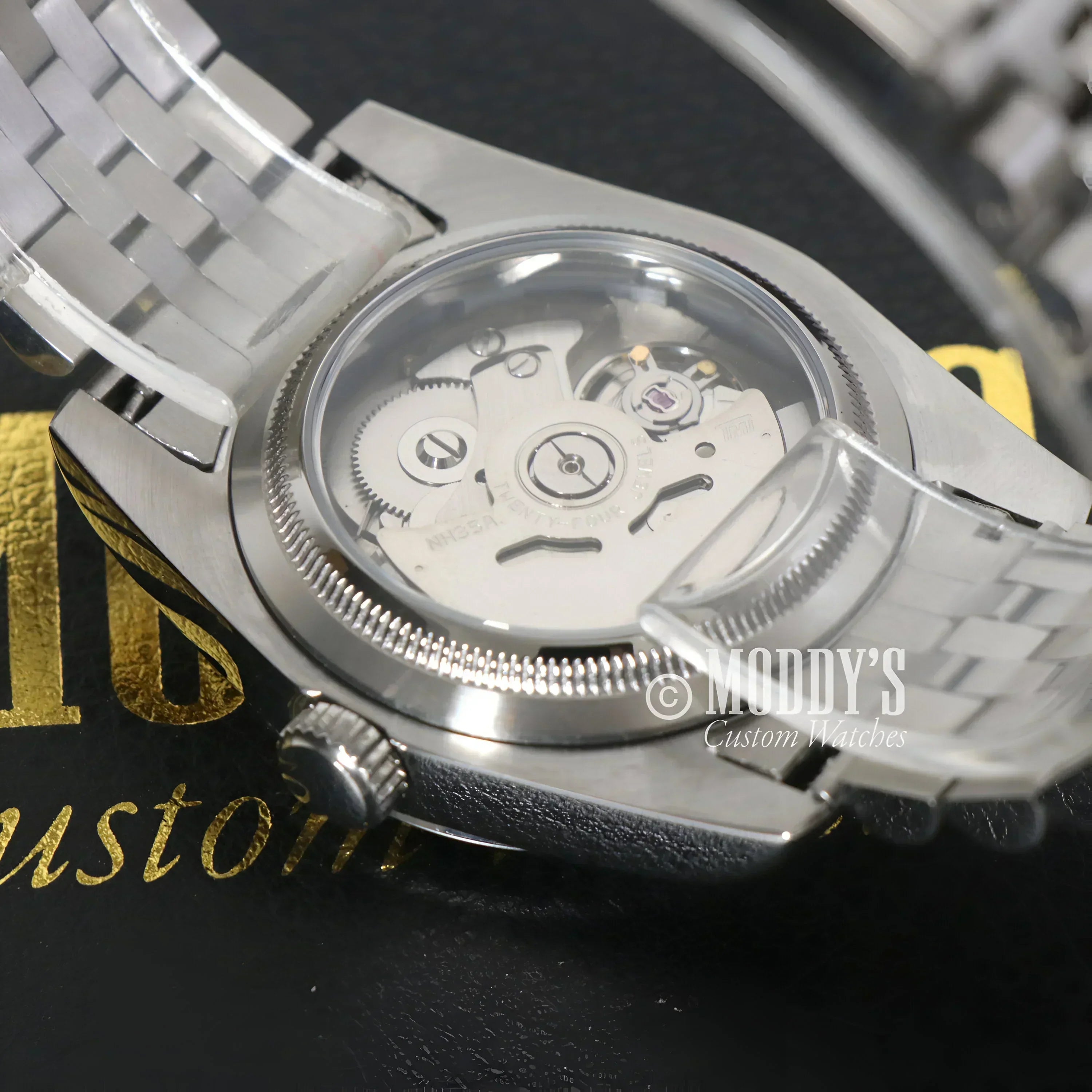 Silver Seikojust Wimbledon wristwatch showcasing intricate gears and Seiko NH35 automatic movement